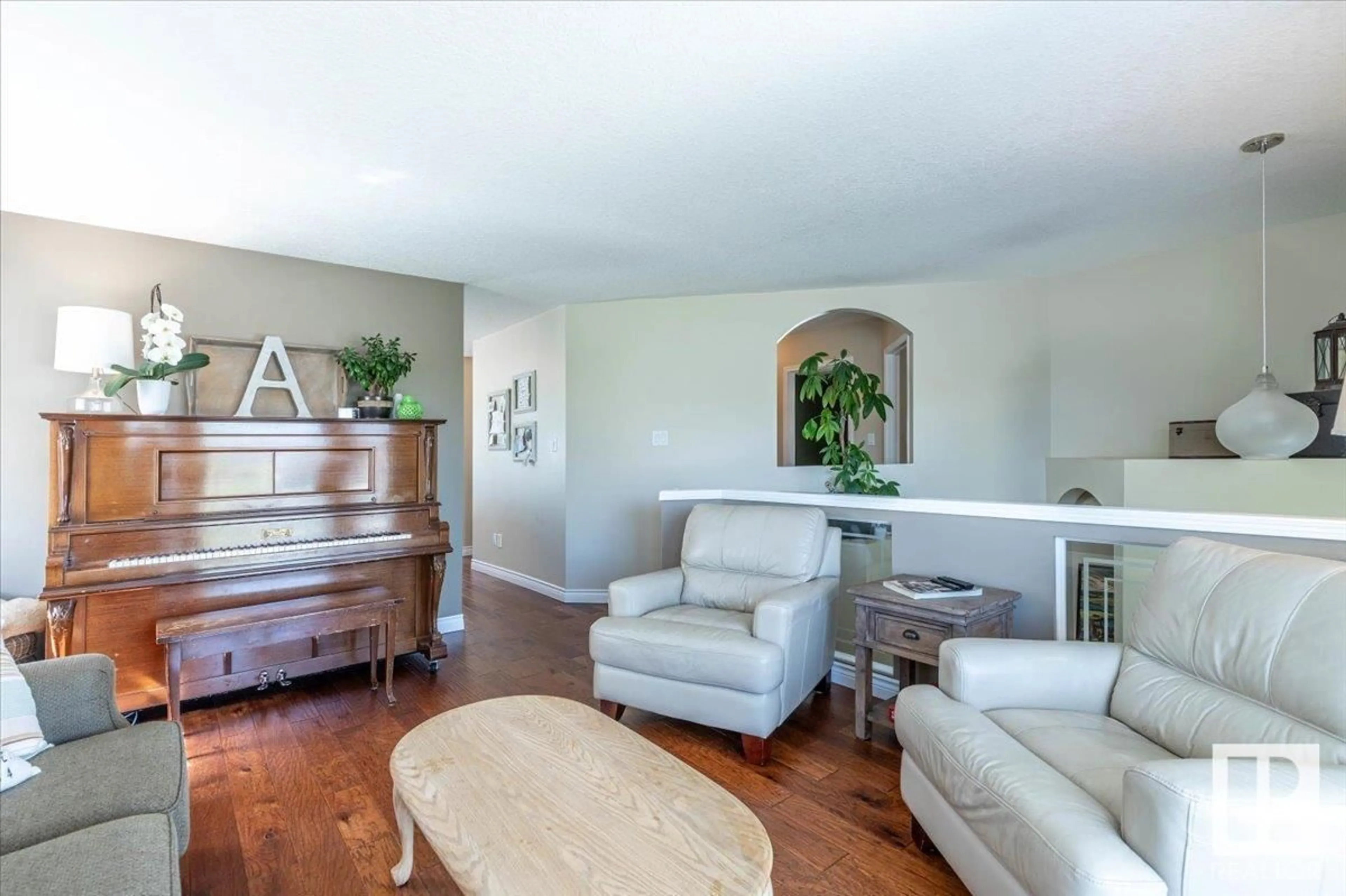 Living room with furniture, wood/laminate floor for 21 MEADOWVIEW DR, Leduc Alberta T9E8E4