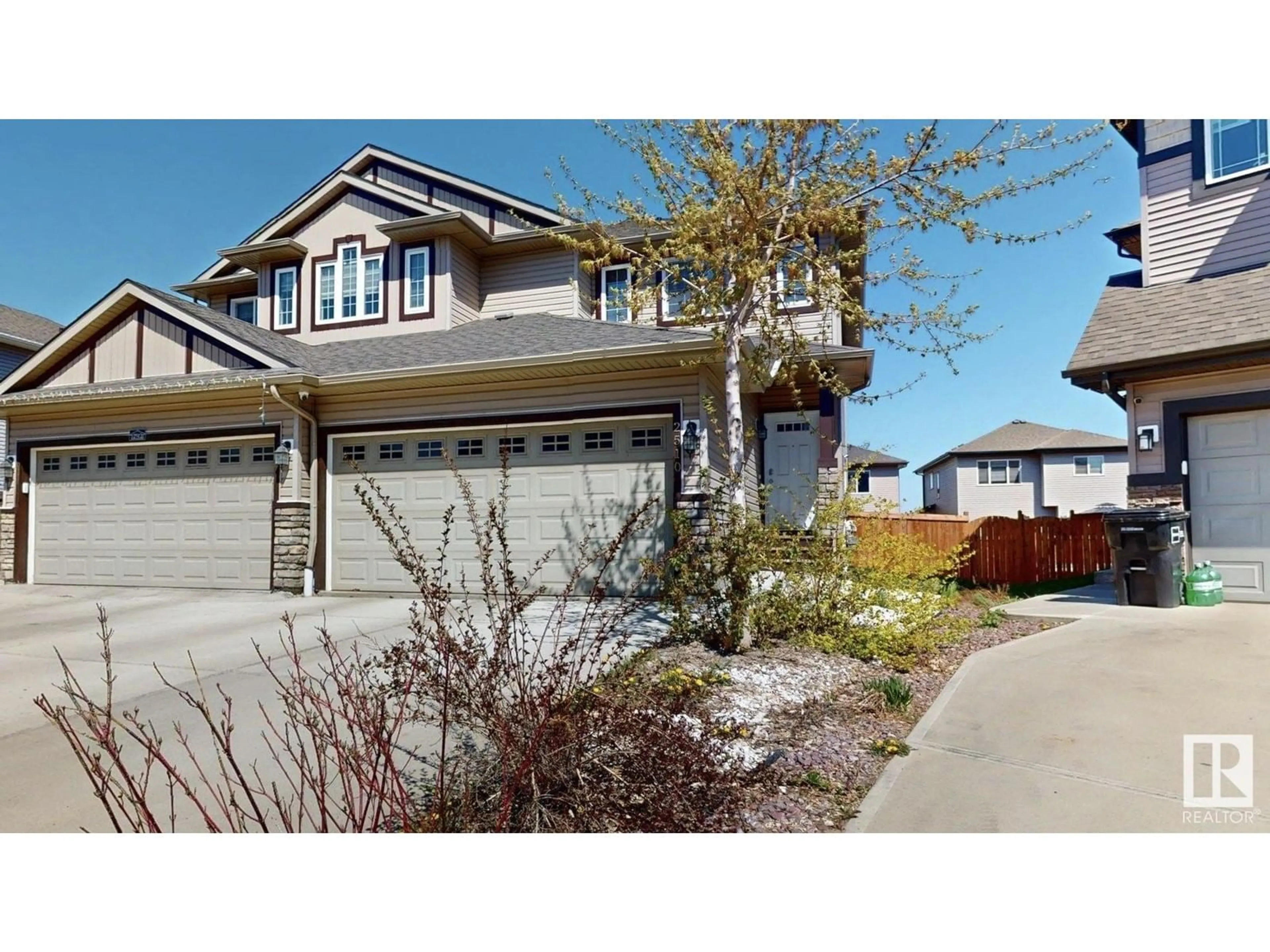 Home with vinyl exterior material, street for 2510 16A AV, Edmonton Alberta T6T2H6