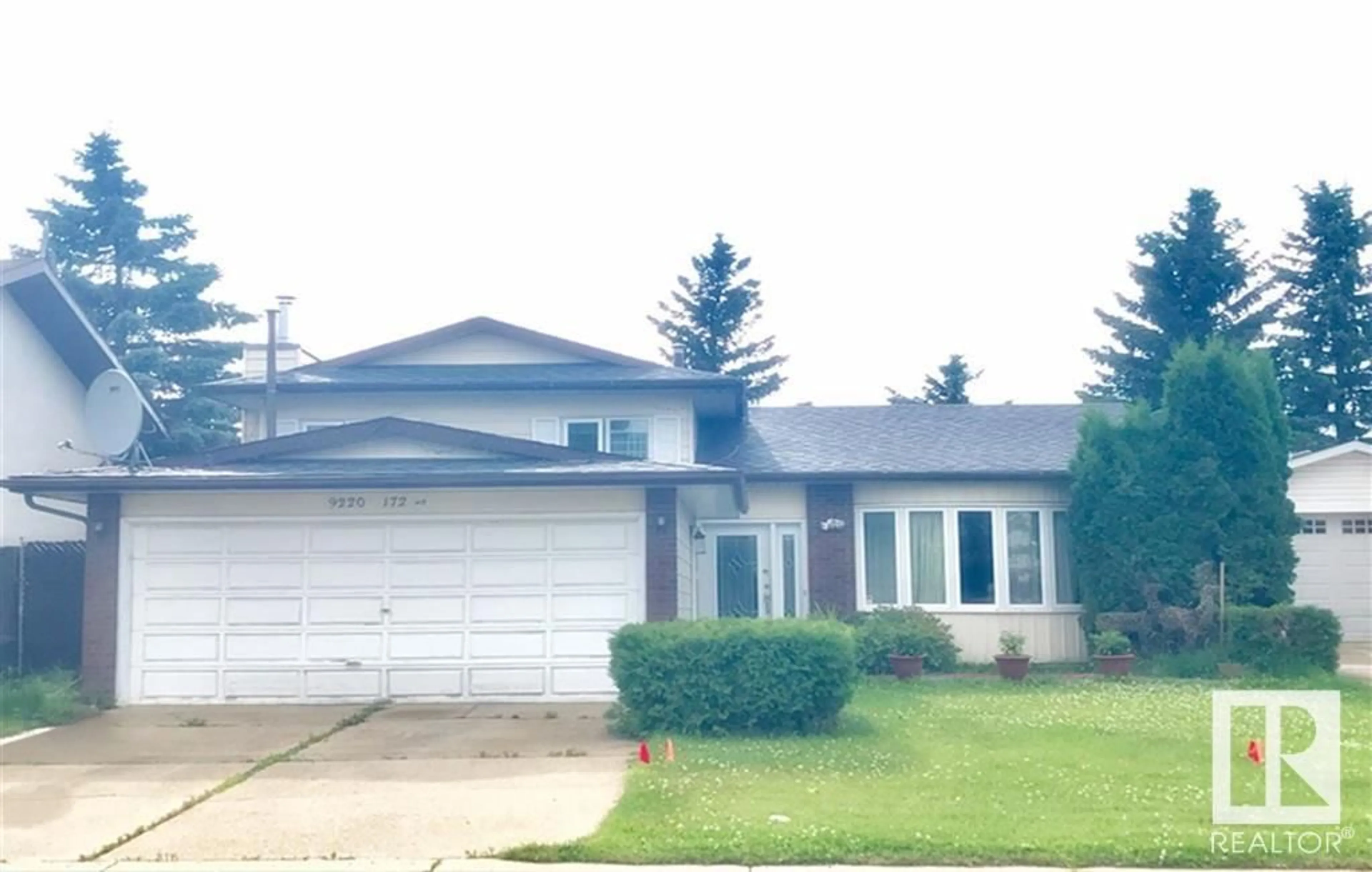 Home with vinyl exterior material, street for 9220 172 ST, Edmonton Alberta T5T3G2