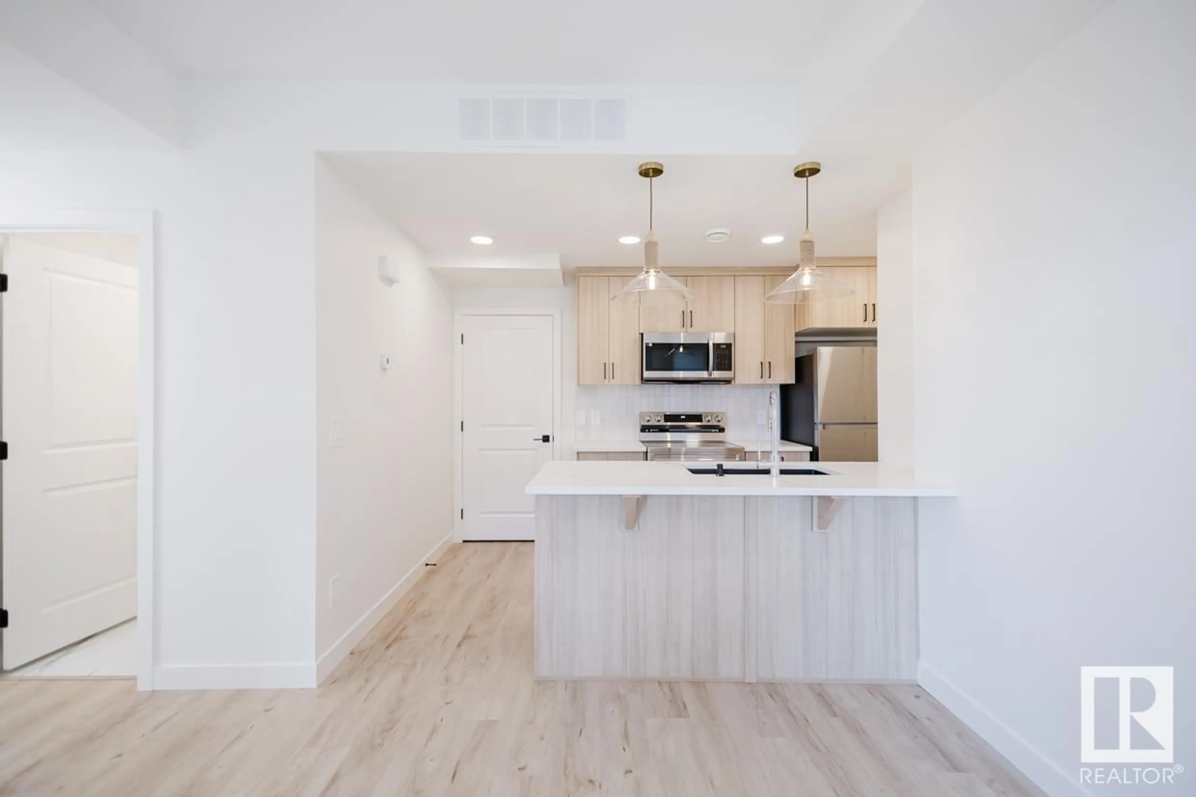 Open concept kitchen, wood/laminate floor for 30 16231 19 AV SW, Edmonton Alberta T6W5C6