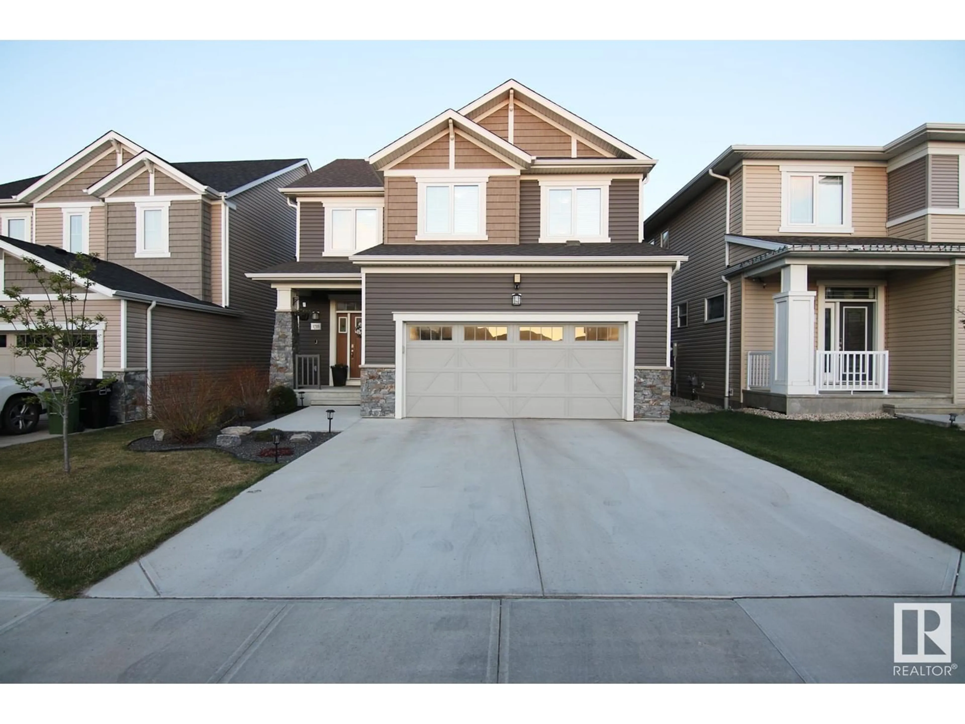Home with vinyl exterior material, street for NW - 1703 201 ST, Edmonton Alberta T6M0Y1