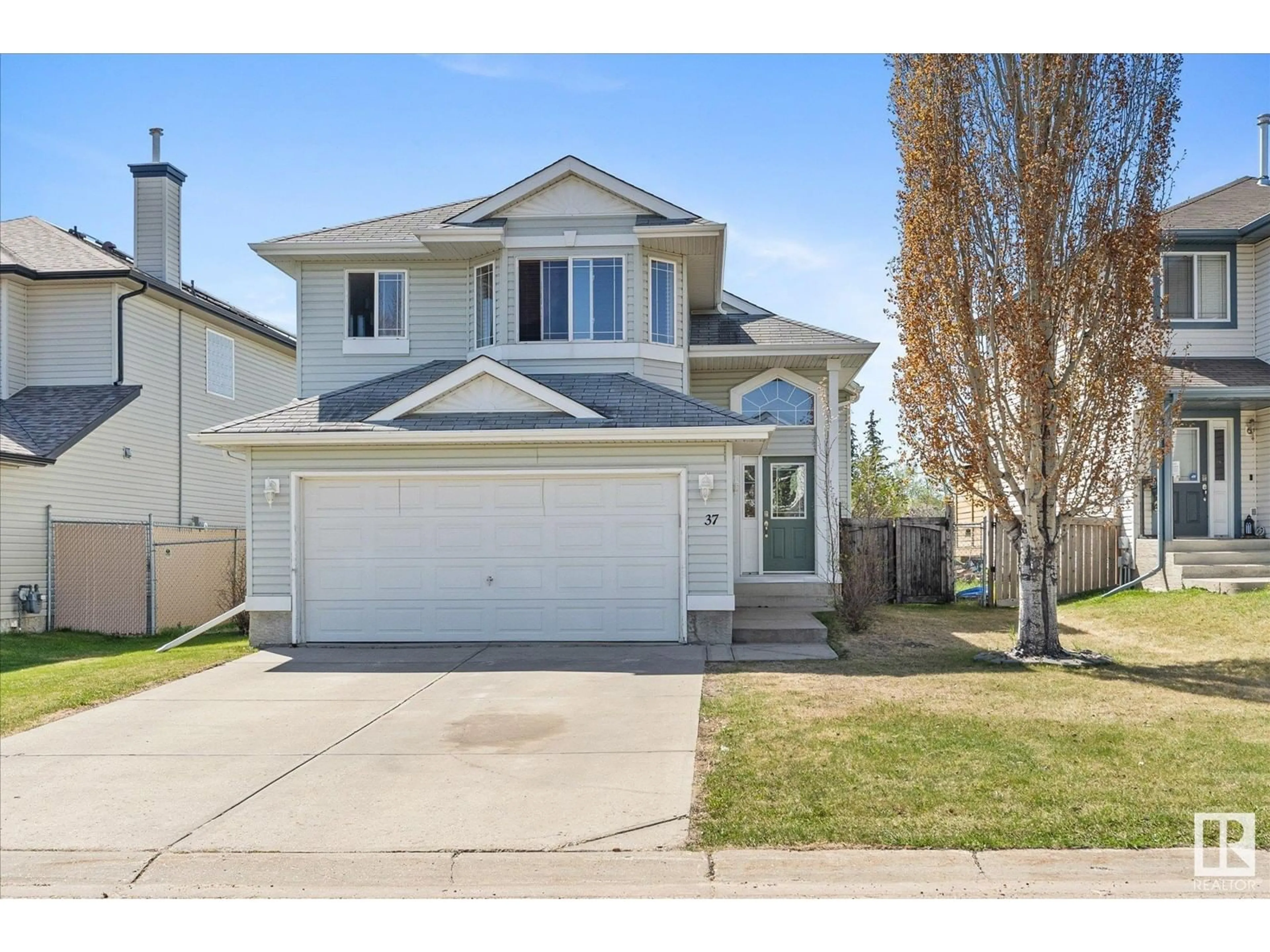 Home with vinyl exterior material, street for 37 HEATHERLANDS WY, Spruce Grove Alberta T7X4L2