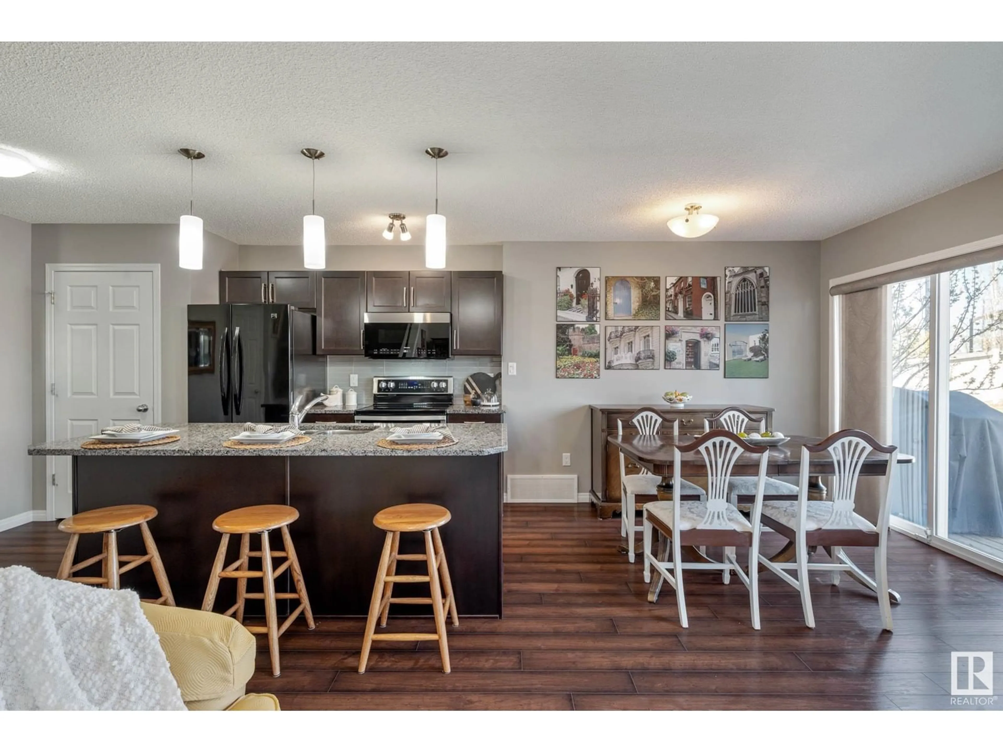 Open concept kitchen, wood/laminate floor for 5385 CRABAPPLE LO, Edmonton Alberta T6X1S5