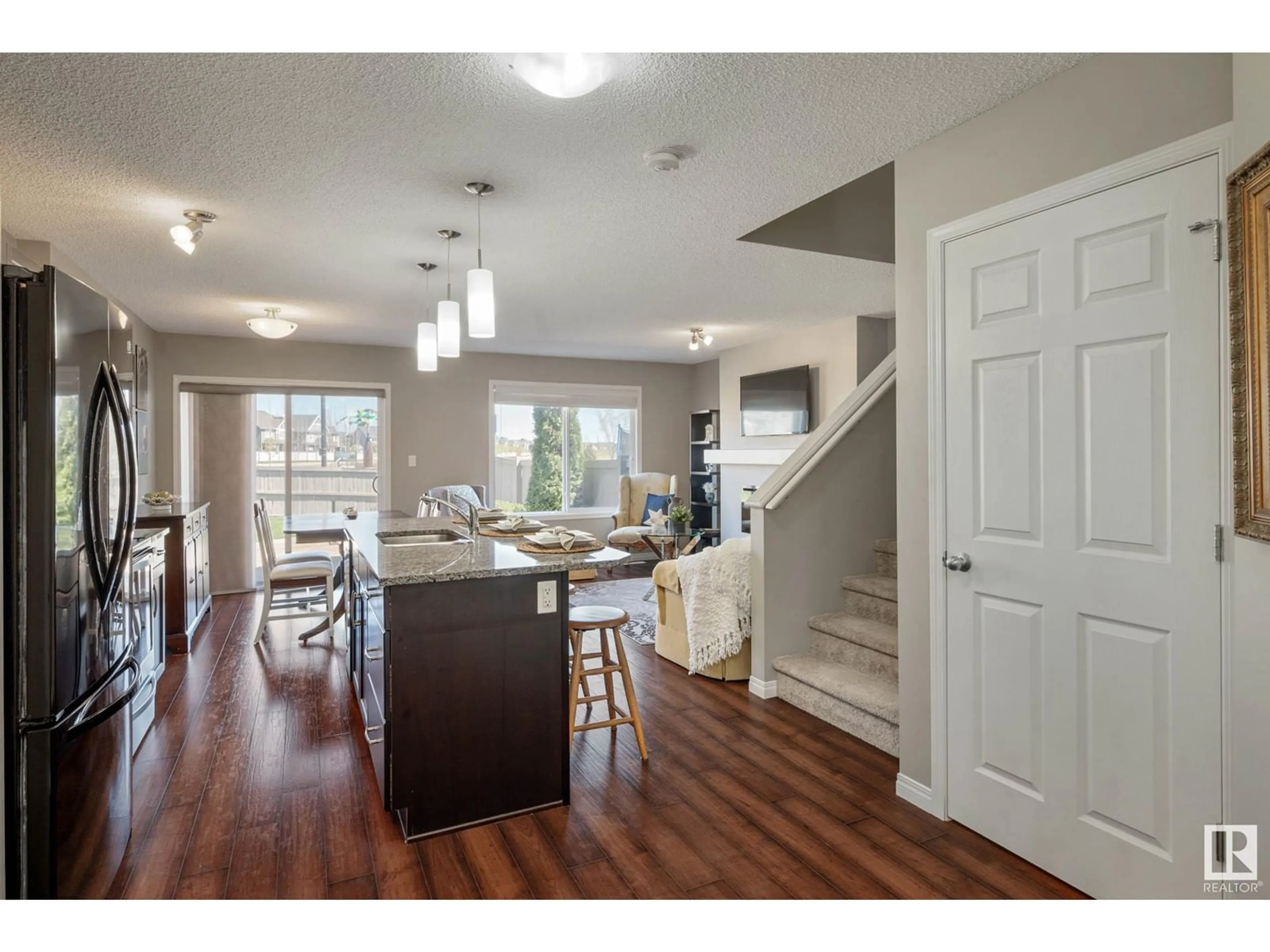 Open concept kitchen, wood/laminate floor for 5385 CRABAPPLE LO, Edmonton Alberta T6X1S5