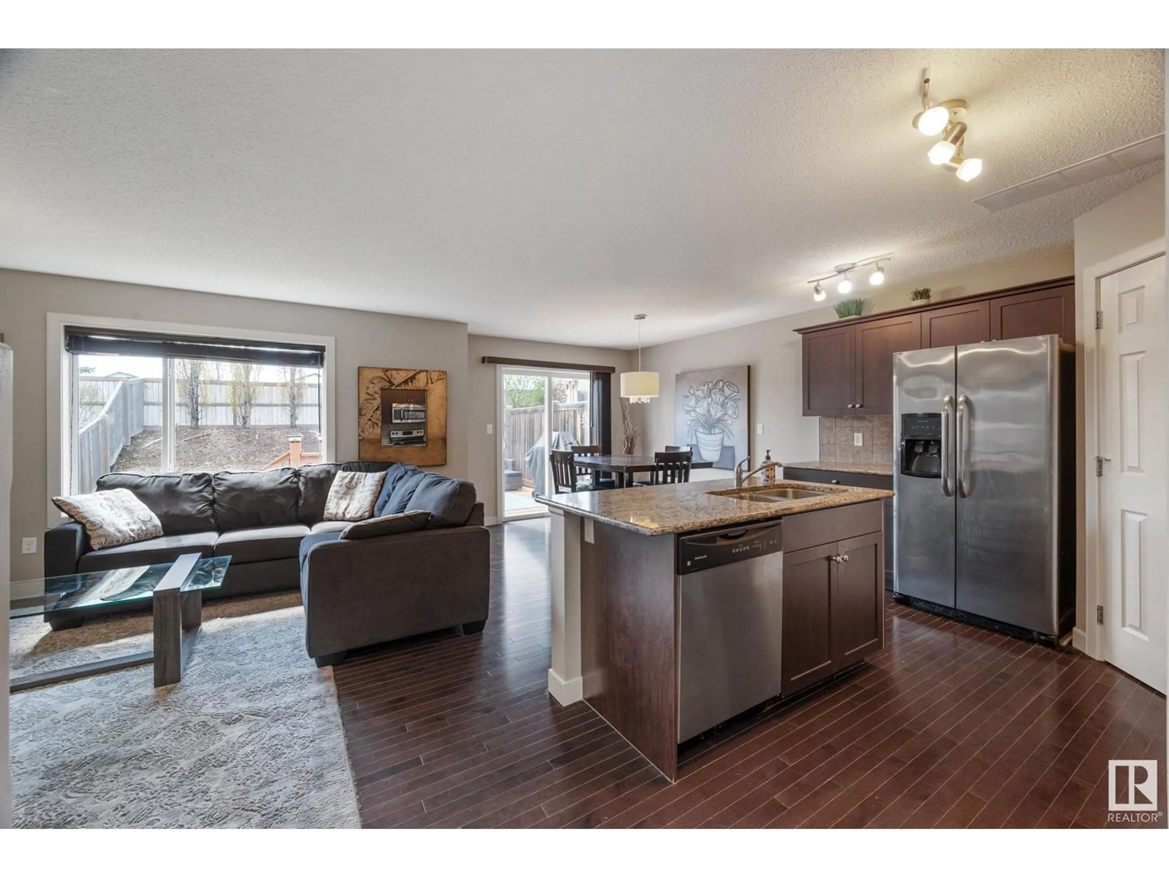 Open concept kitchen, wood/laminate floor for 6053 SUNBROOK LN, Sherwood Park Alberta T8H0J6