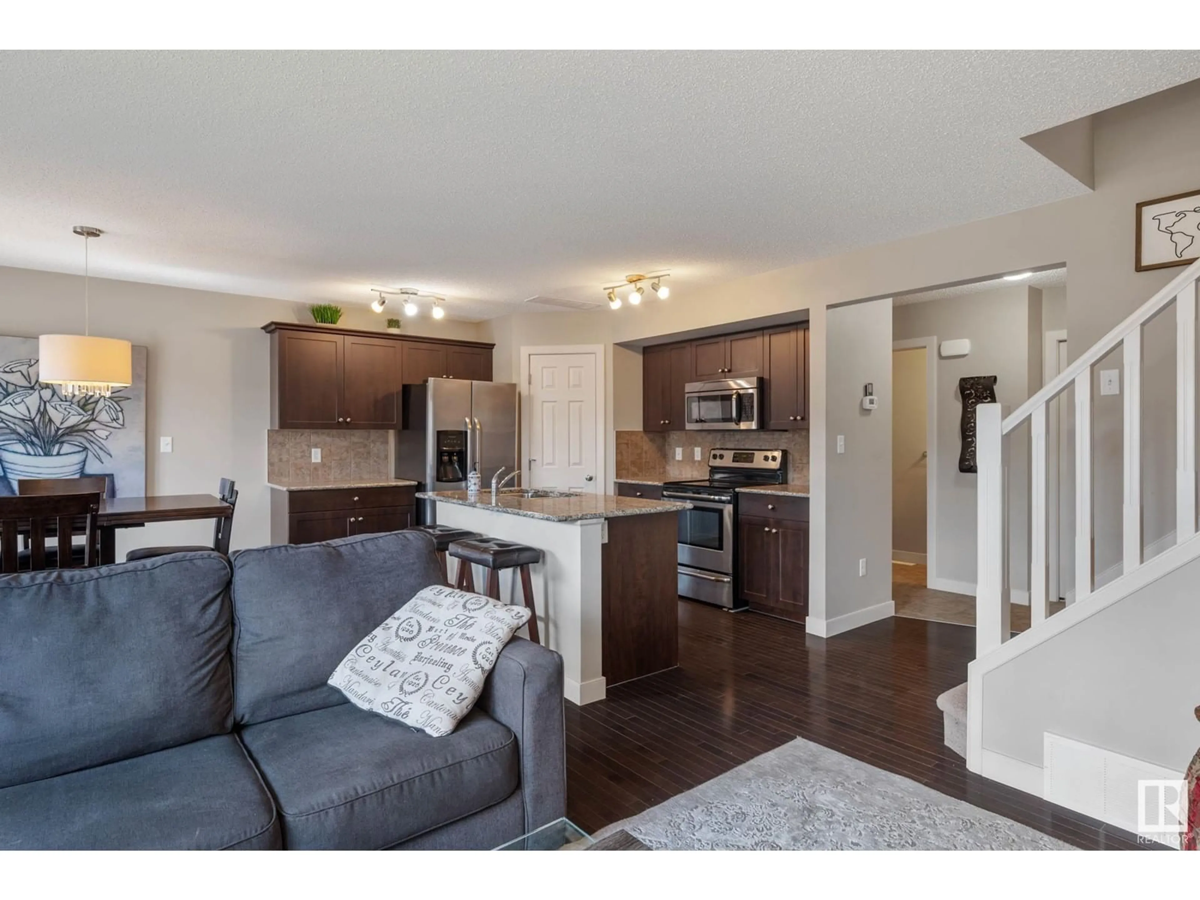 Open concept kitchen, wood/laminate floor for 6053 SUNBROOK LN, Sherwood Park Alberta T8H0J6