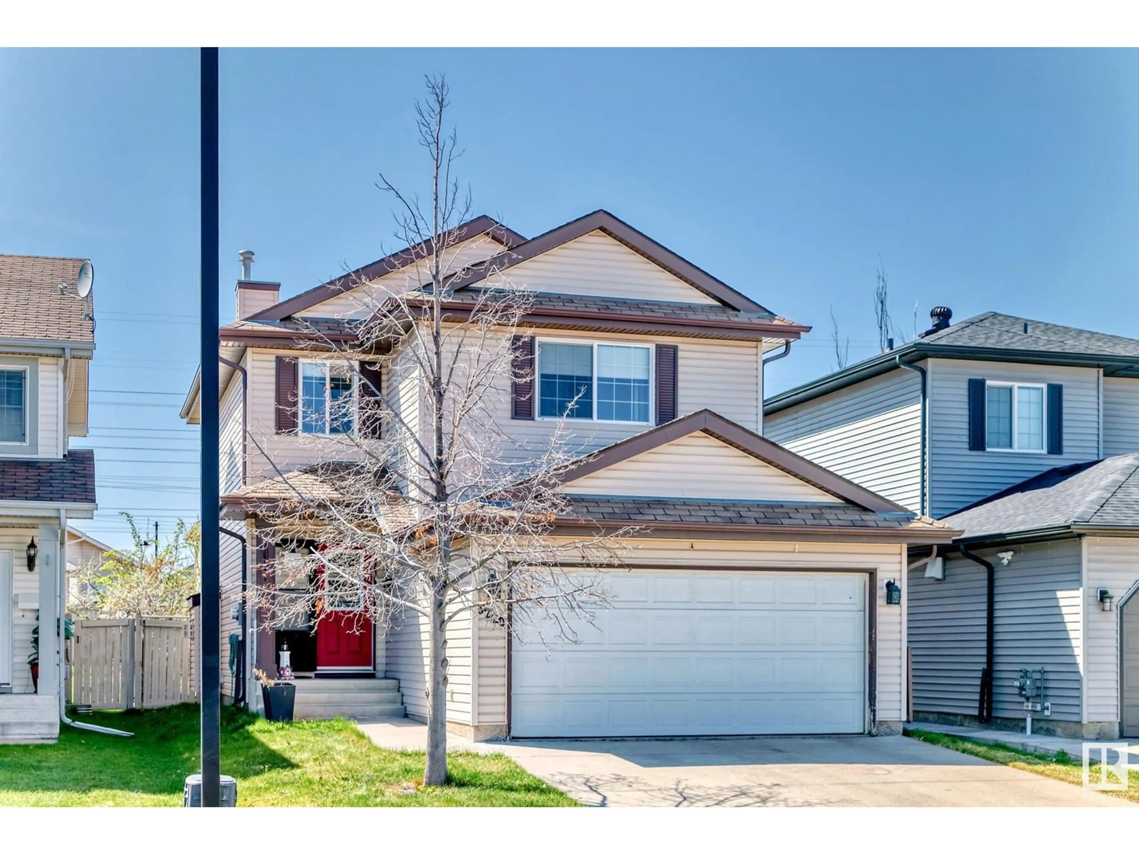 Home with vinyl exterior material, street for 3220 25 ST, Edmonton Alberta T6T1Z6