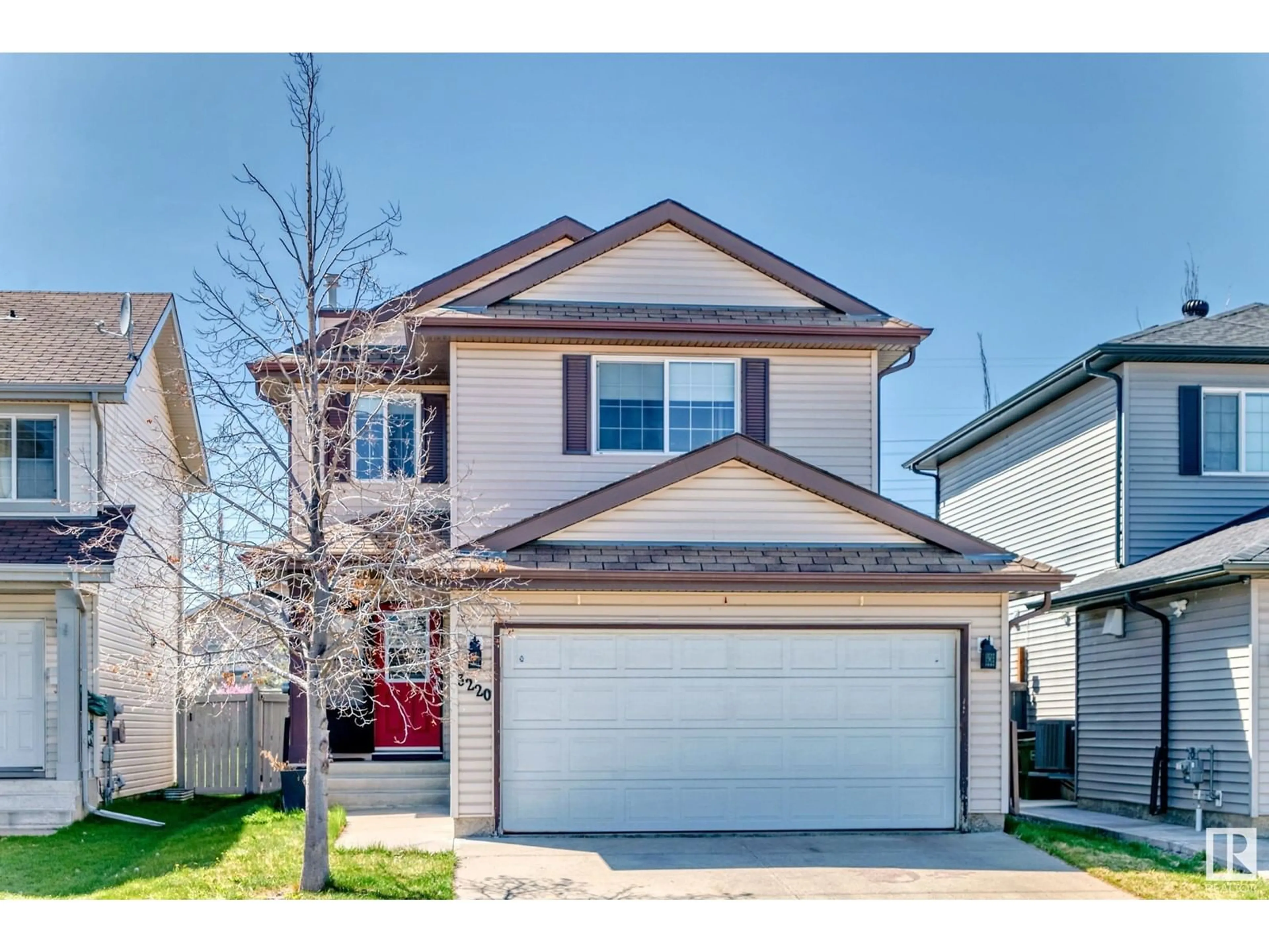 Home with vinyl exterior material, street for 3220 25 ST, Edmonton Alberta T6T1Z6