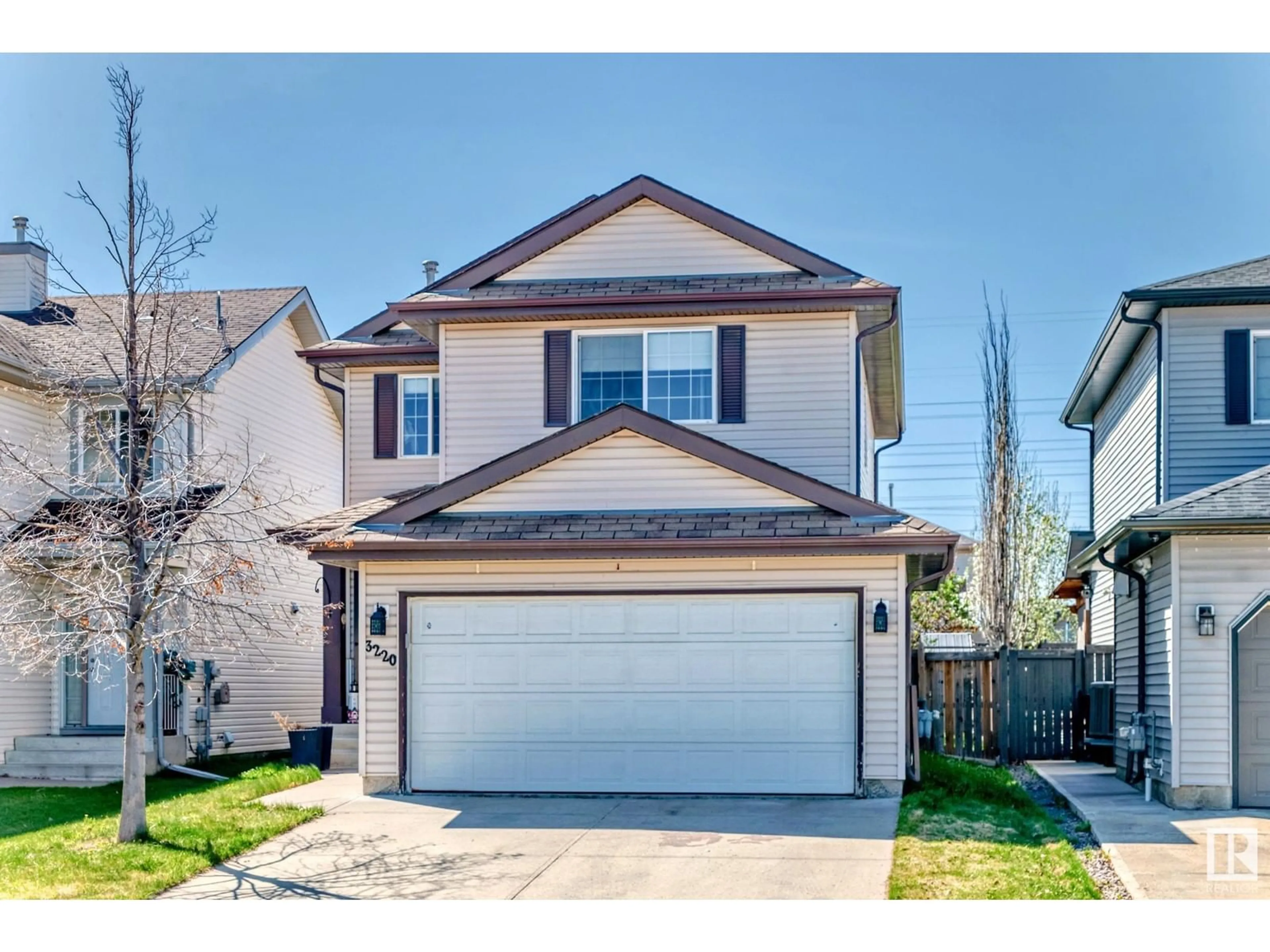 Home with vinyl exterior material, street for 3220 25 ST, Edmonton Alberta T6T1Z6