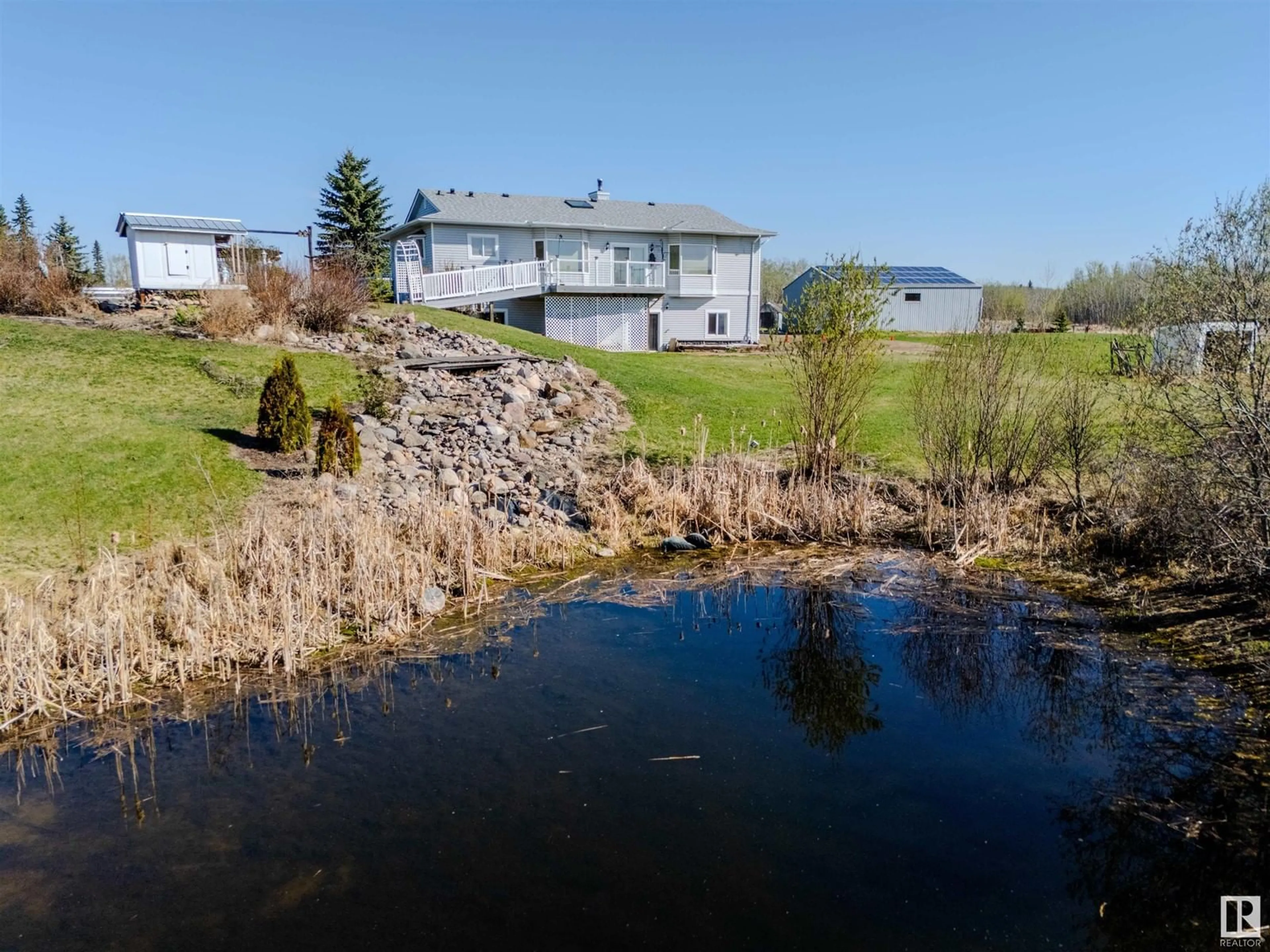 A pic from outside/outdoor area/front of a property/back of a property/a pic from drone, water/lake/river/ocean view for 52229 RGE ROAD 225, Rural Strathcona County Alberta T8C1C7