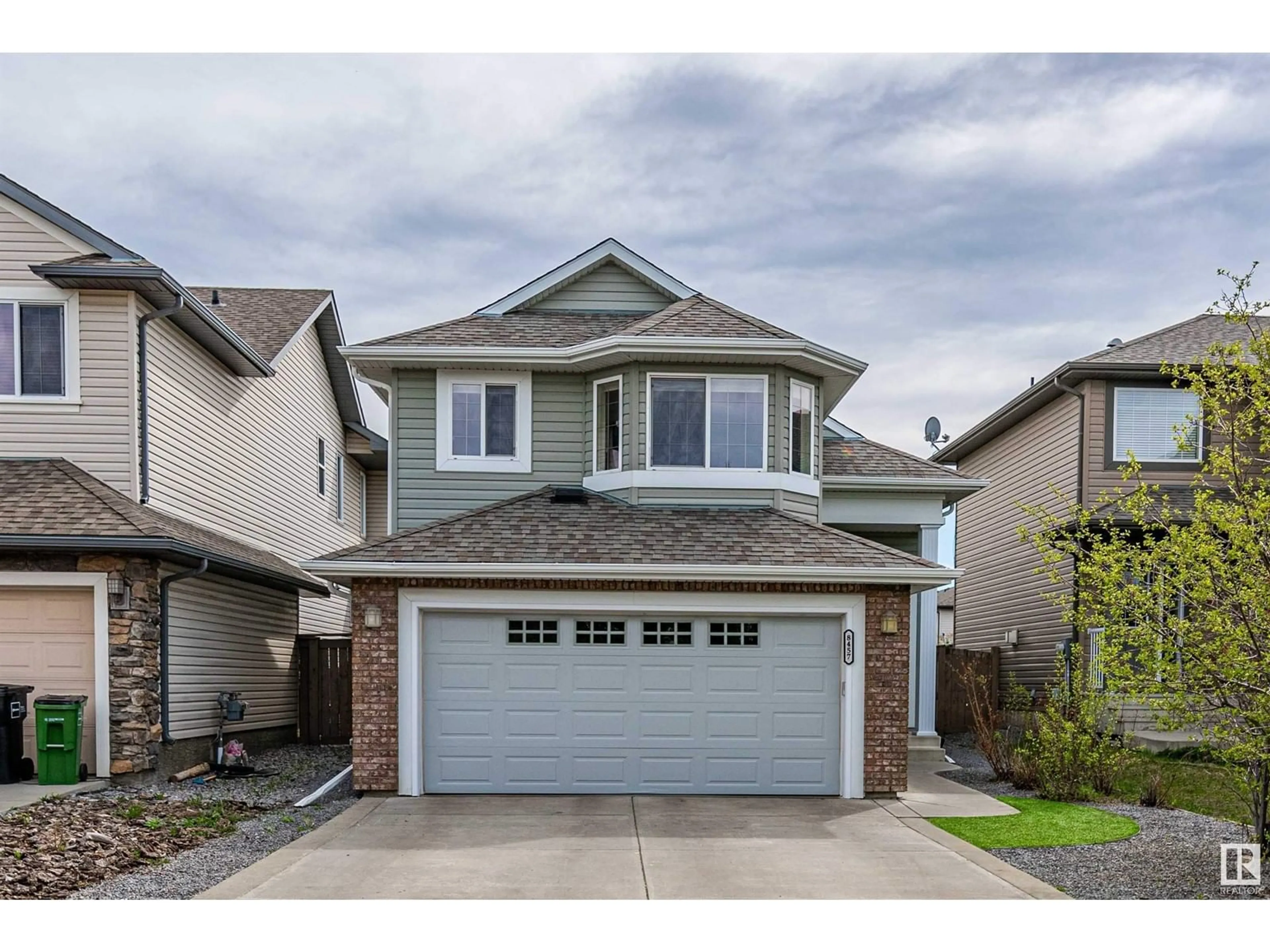 Home with vinyl exterior material, street for 8457 SLOANE CR, Edmonton Alberta T6R0L3