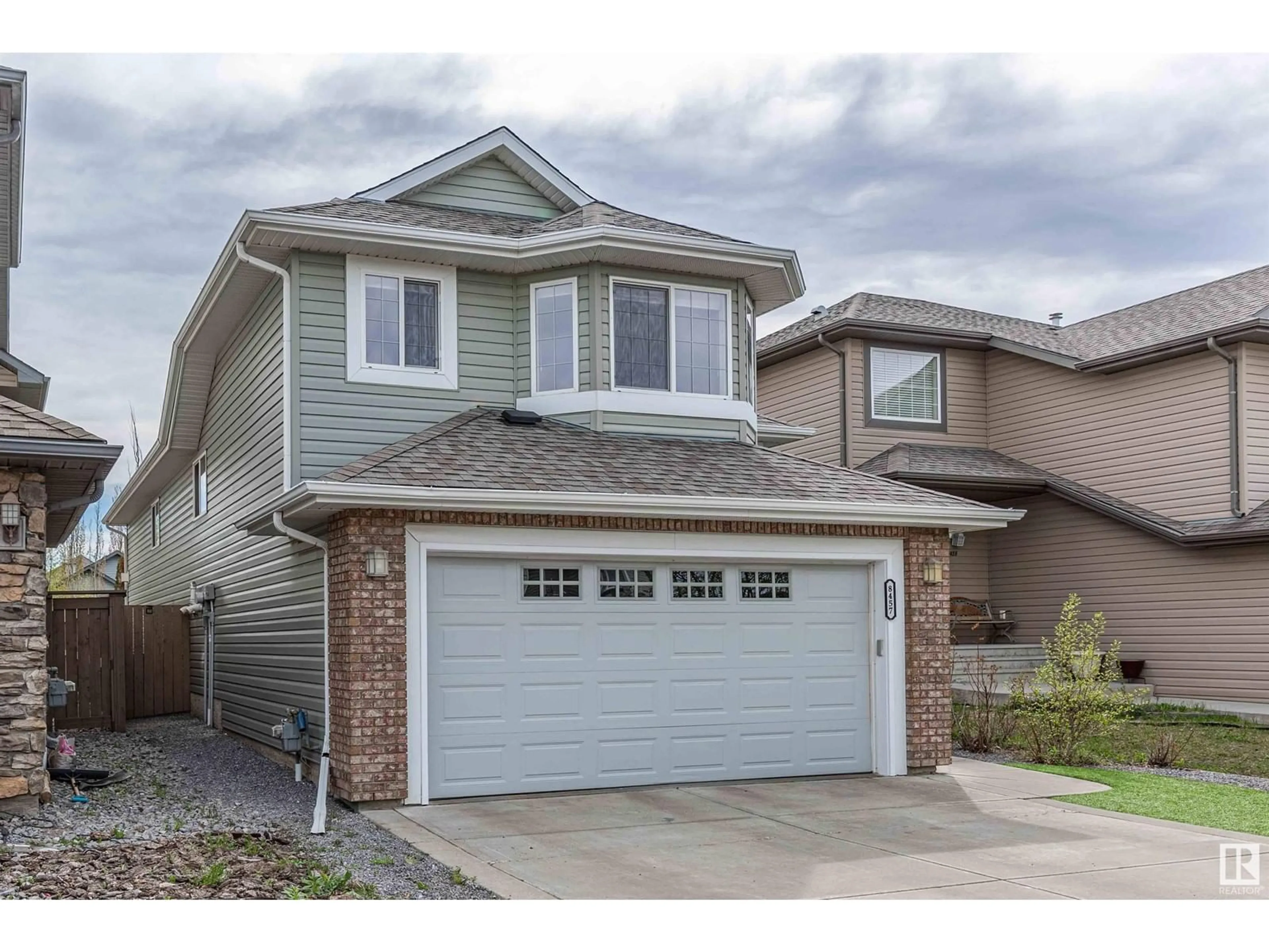 Home with vinyl exterior material, street for 8457 SLOANE CR, Edmonton Alberta T6R0L3
