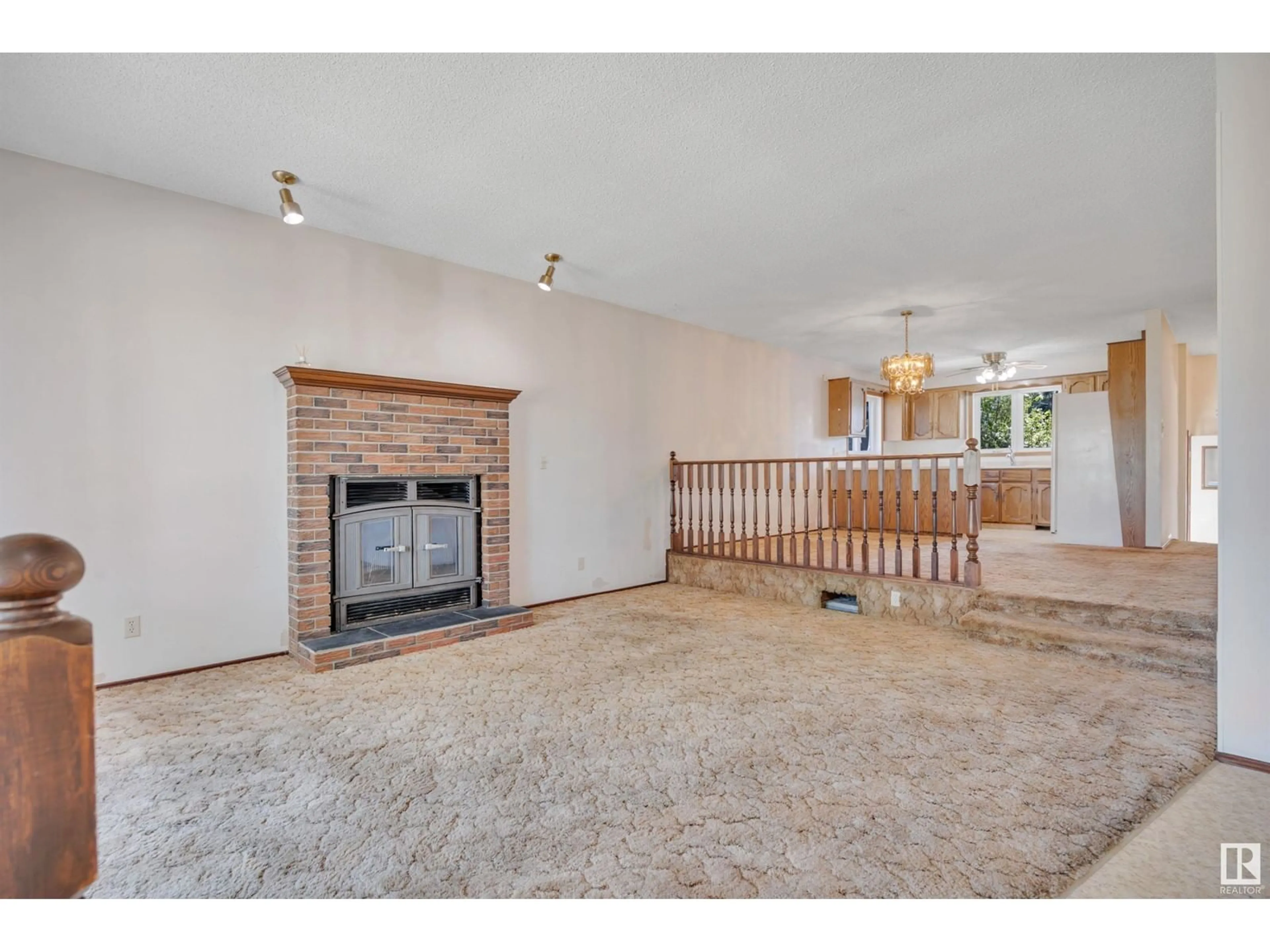 Living room with furniture, unknown for 4633 115 AV, Edmonton Alberta T5W0W1
