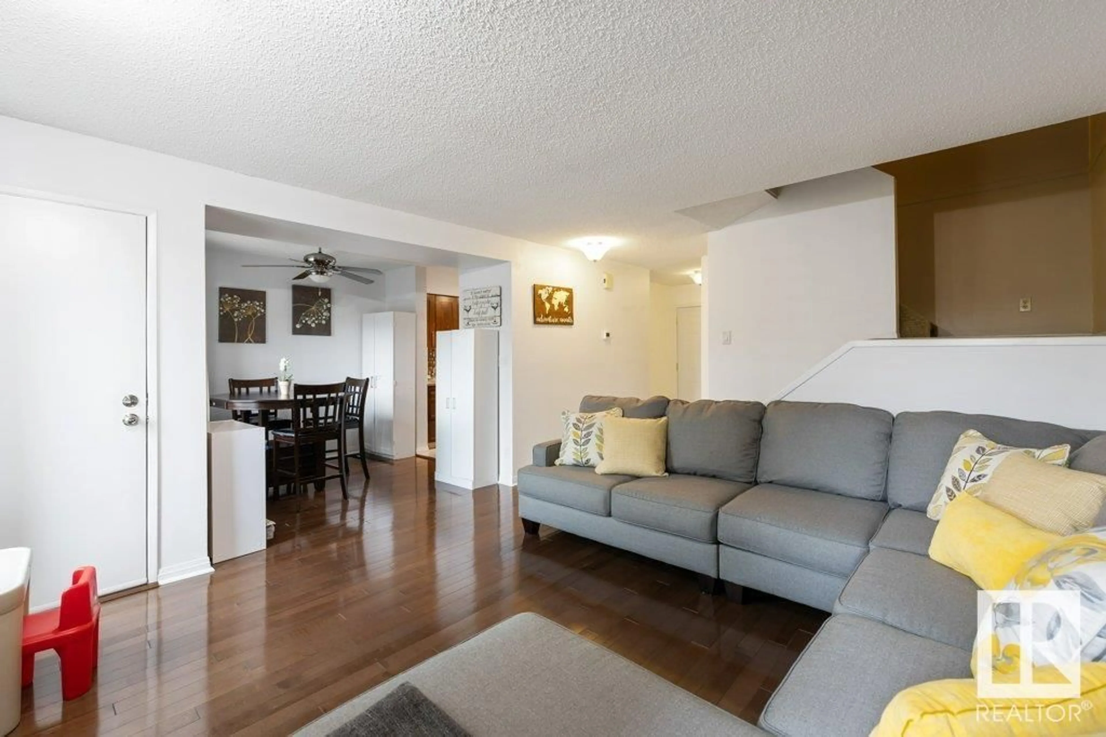 Living room with furniture, wood/laminate floor for 16913 95 ST, Edmonton Alberta T5Z1Z2