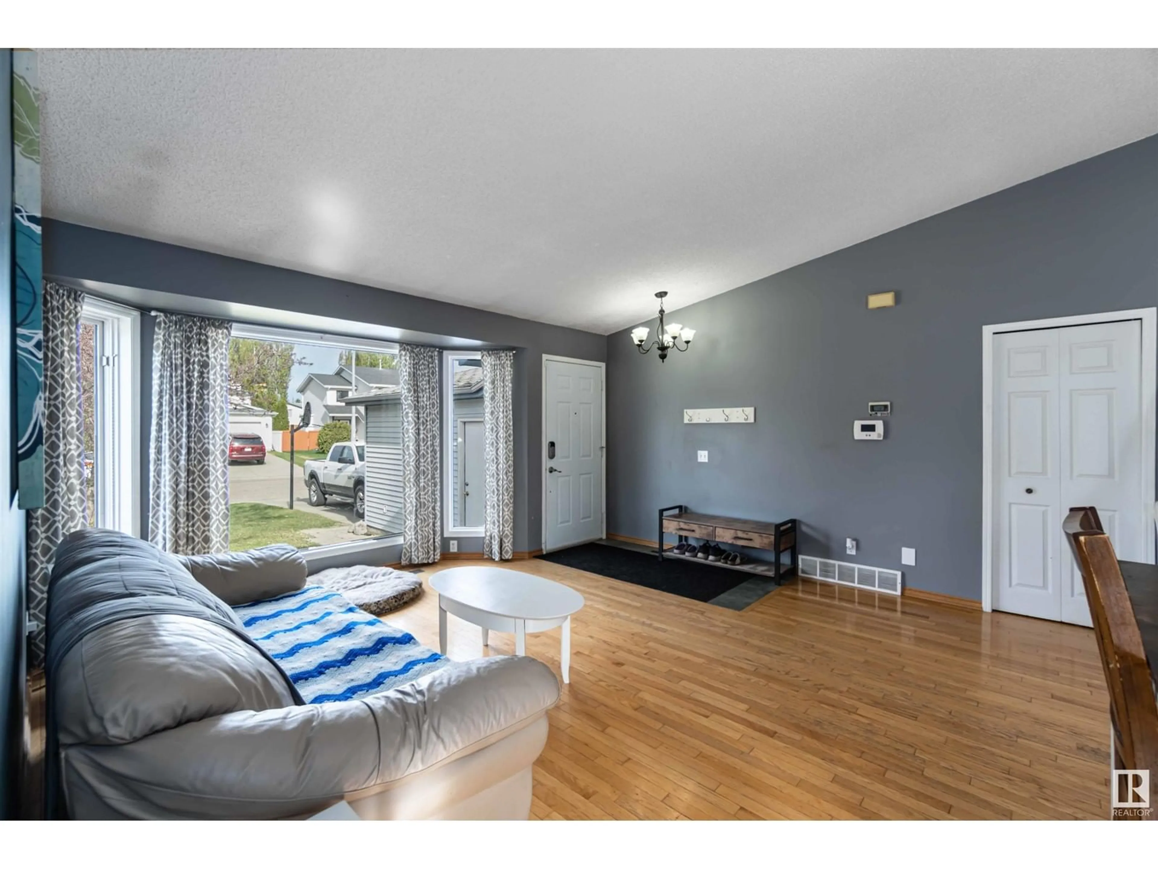 Living room with furniture, wood/laminate floor for 24 ABERDEEN CR, Stony Plain Alberta T7Z1K4