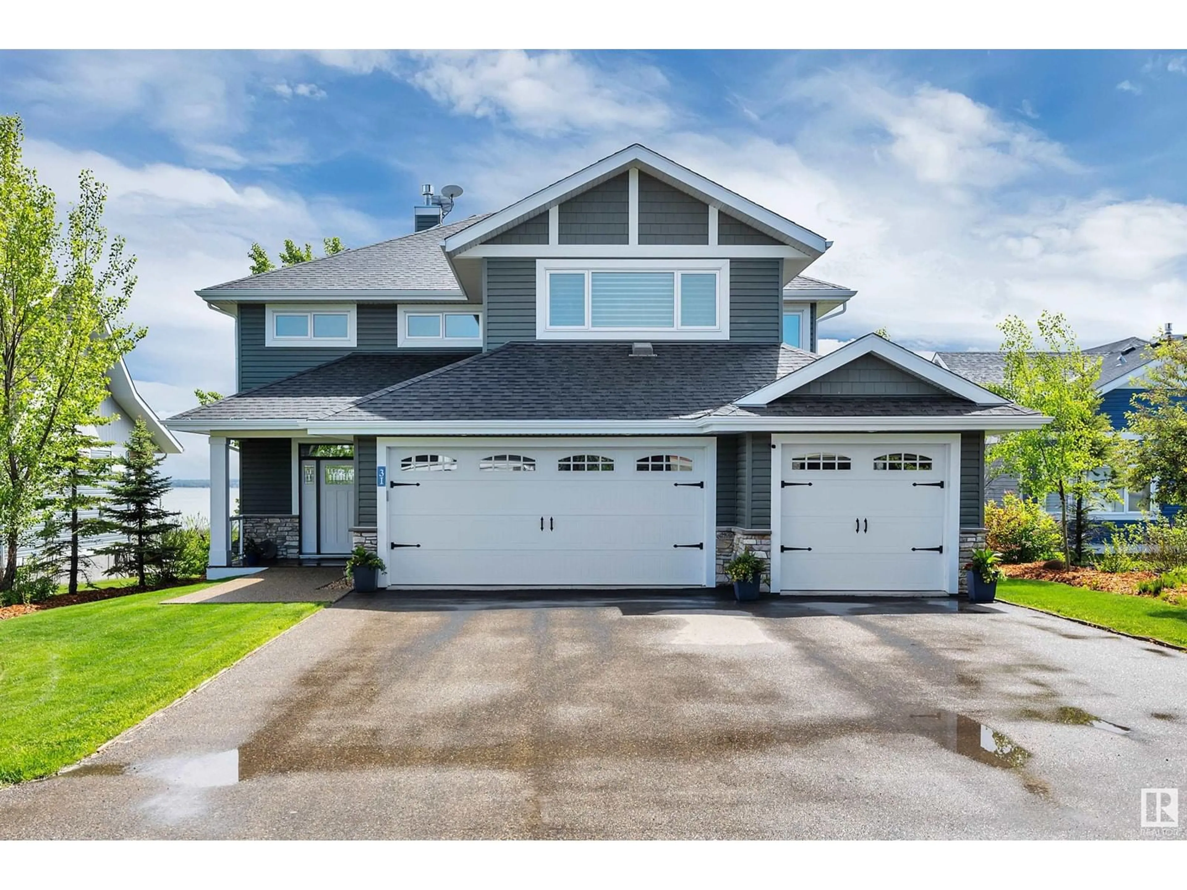 Home with vinyl exterior material, street for 31 STE. ANNE TR, Rural Lac Ste. Anne County Alberta T0E1A1