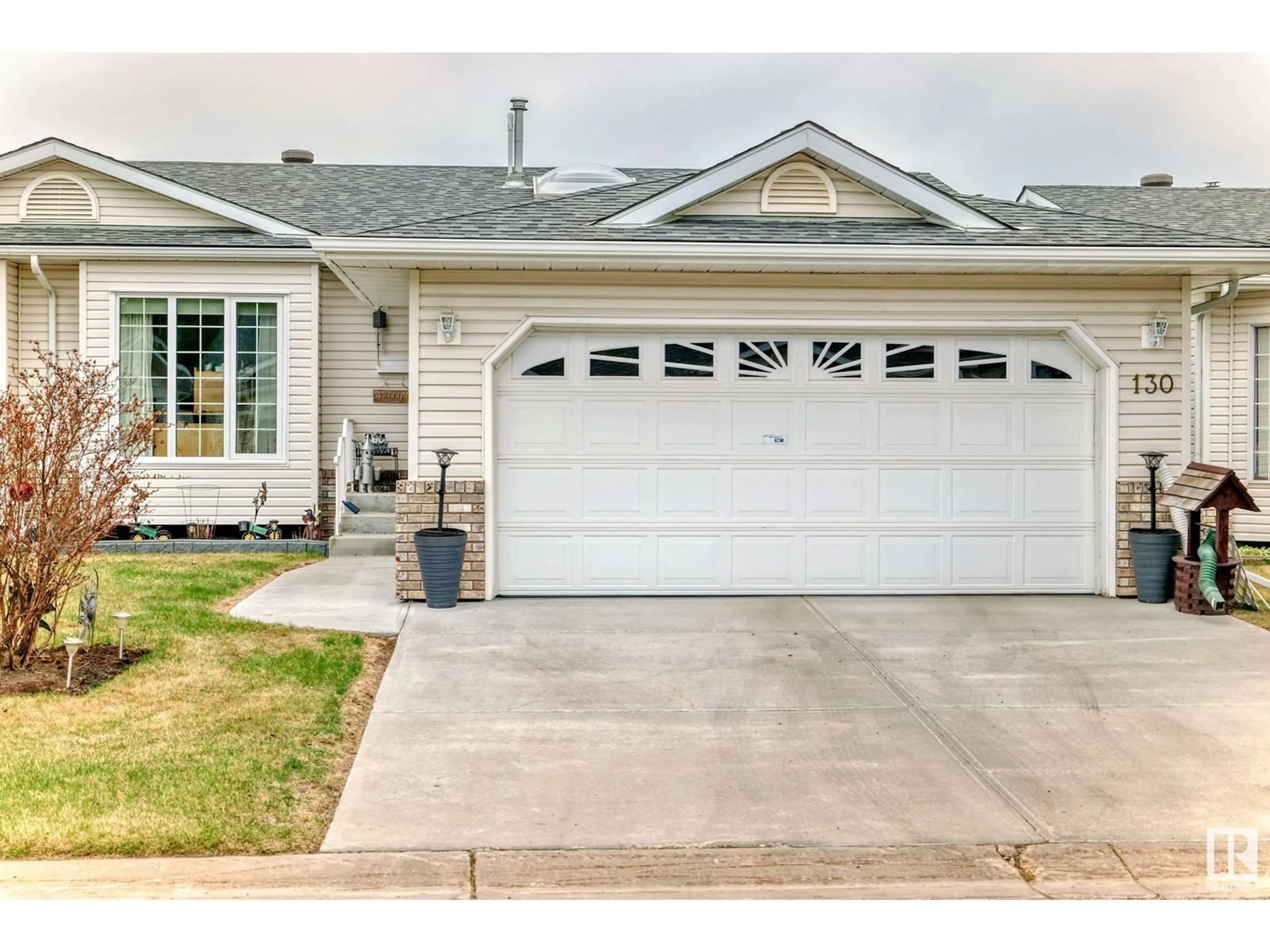 Home with vinyl exterior material, street for 130 RAVINE VI, Leduc Alberta T9E6R1