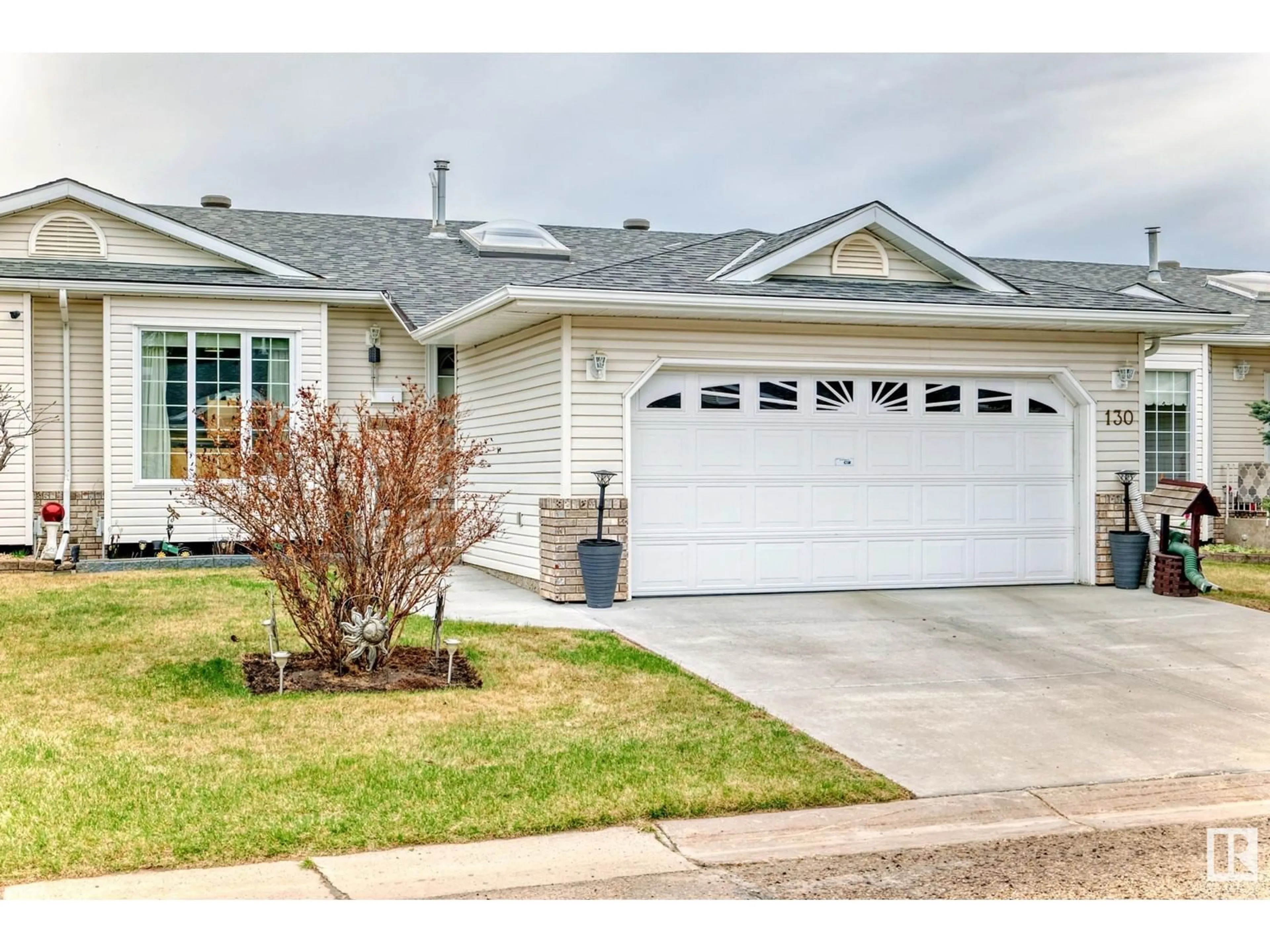 Home with vinyl exterior material, street for 130 RAVINE VI, Leduc Alberta T9E6R1