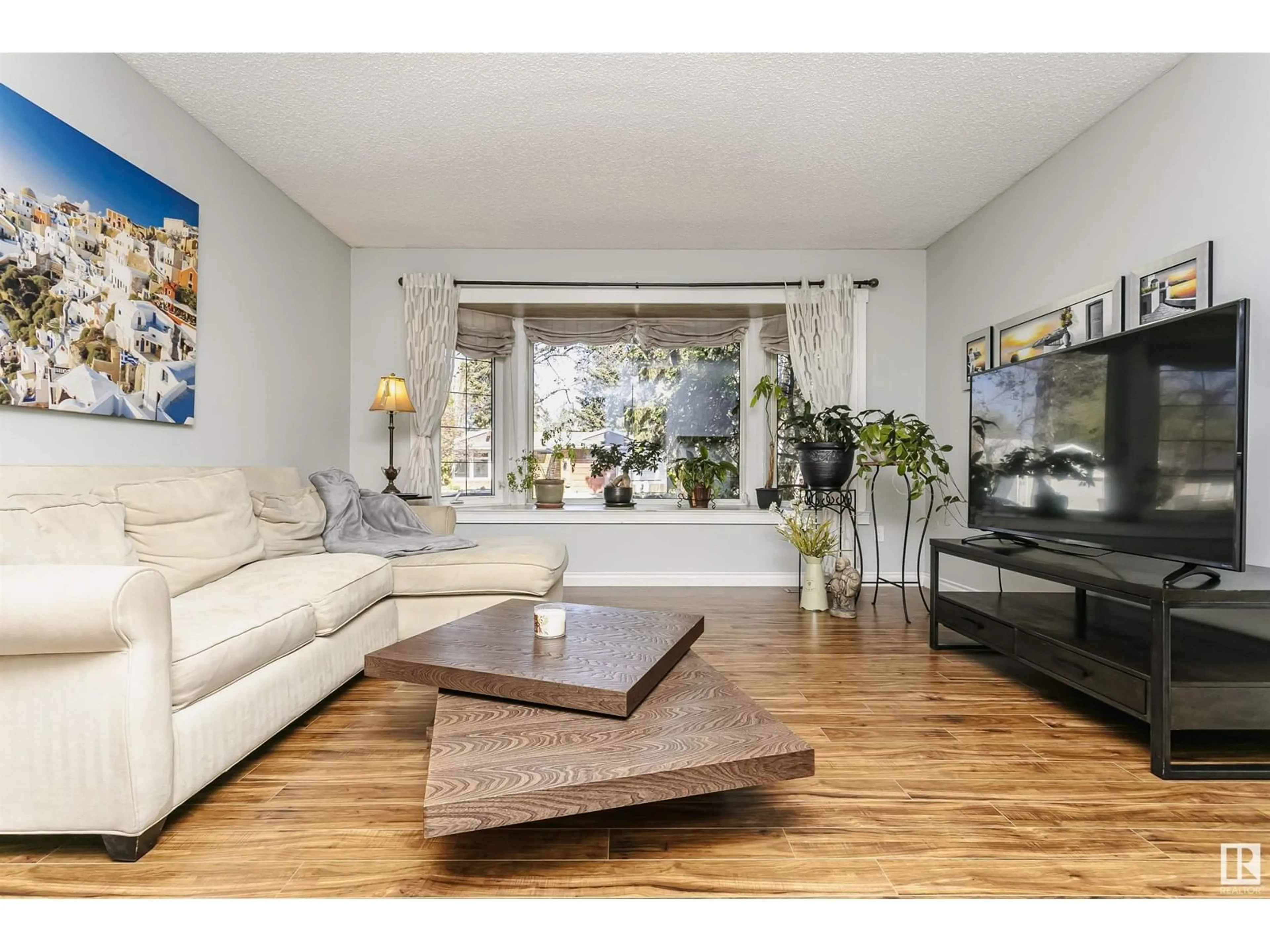 Living room with furniture, wood/laminate floor for 28 LABELLE CR, St. Albert Alberta T8N2G5