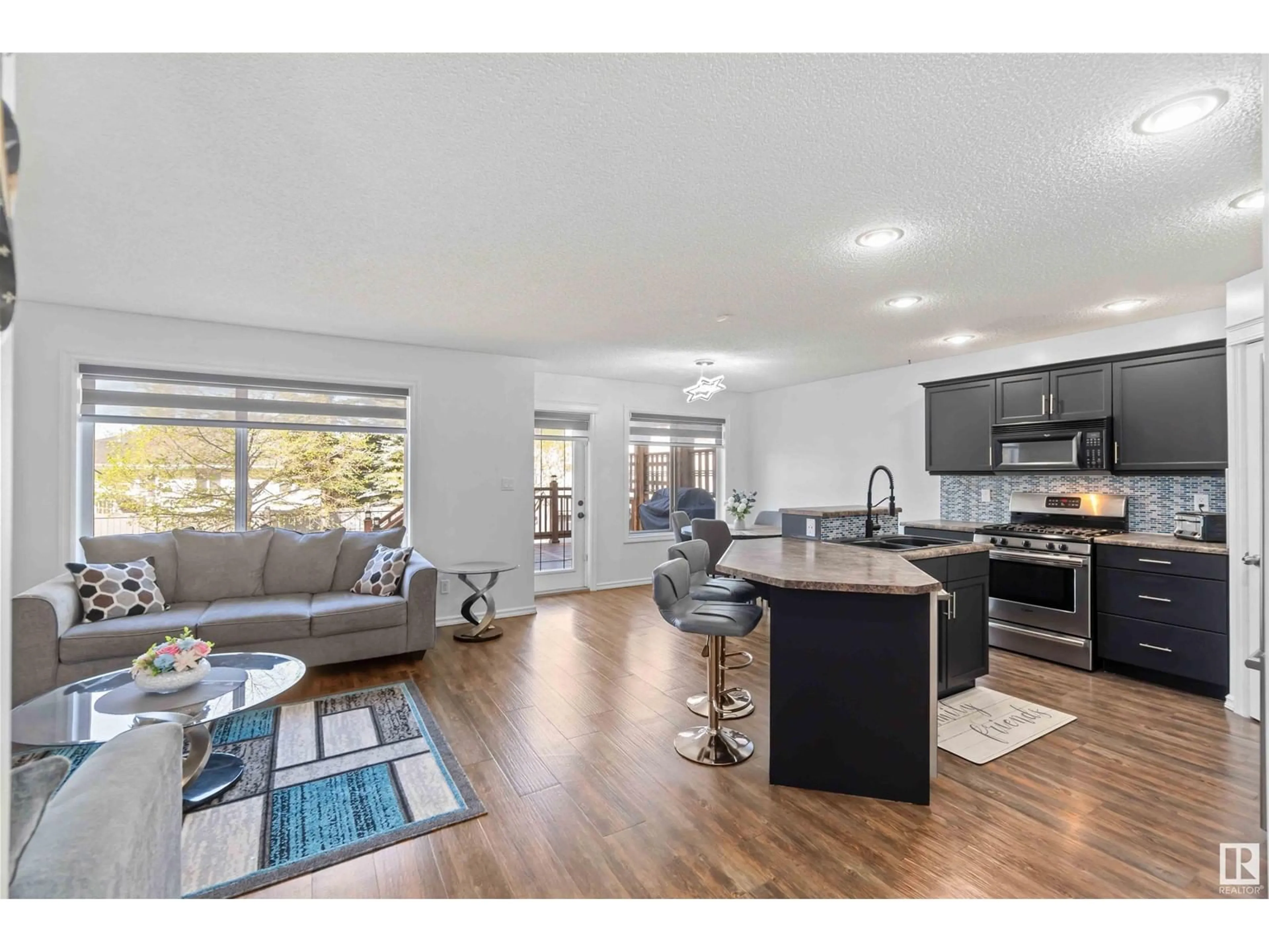 Open concept kitchen, wood/laminate floor for NW - 2904 33A ST, Edmonton Alberta T6T1V5