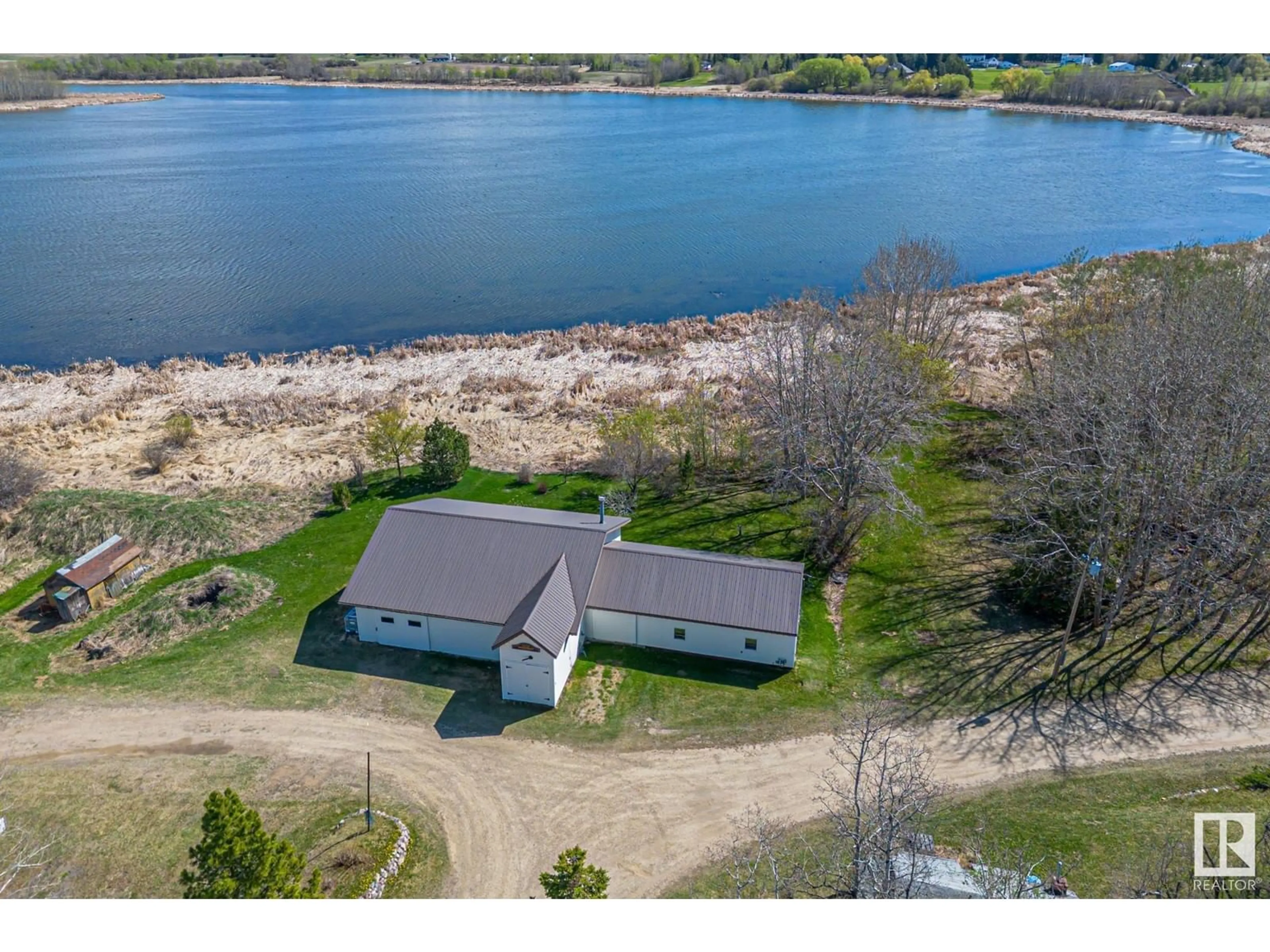 A pic from outside/outdoor area/front of a property/back of a property/a pic from drone, water/lake/river/ocean view for 52175 RGE ROAD 224, Rural Strathcona County Alberta T8C1B7