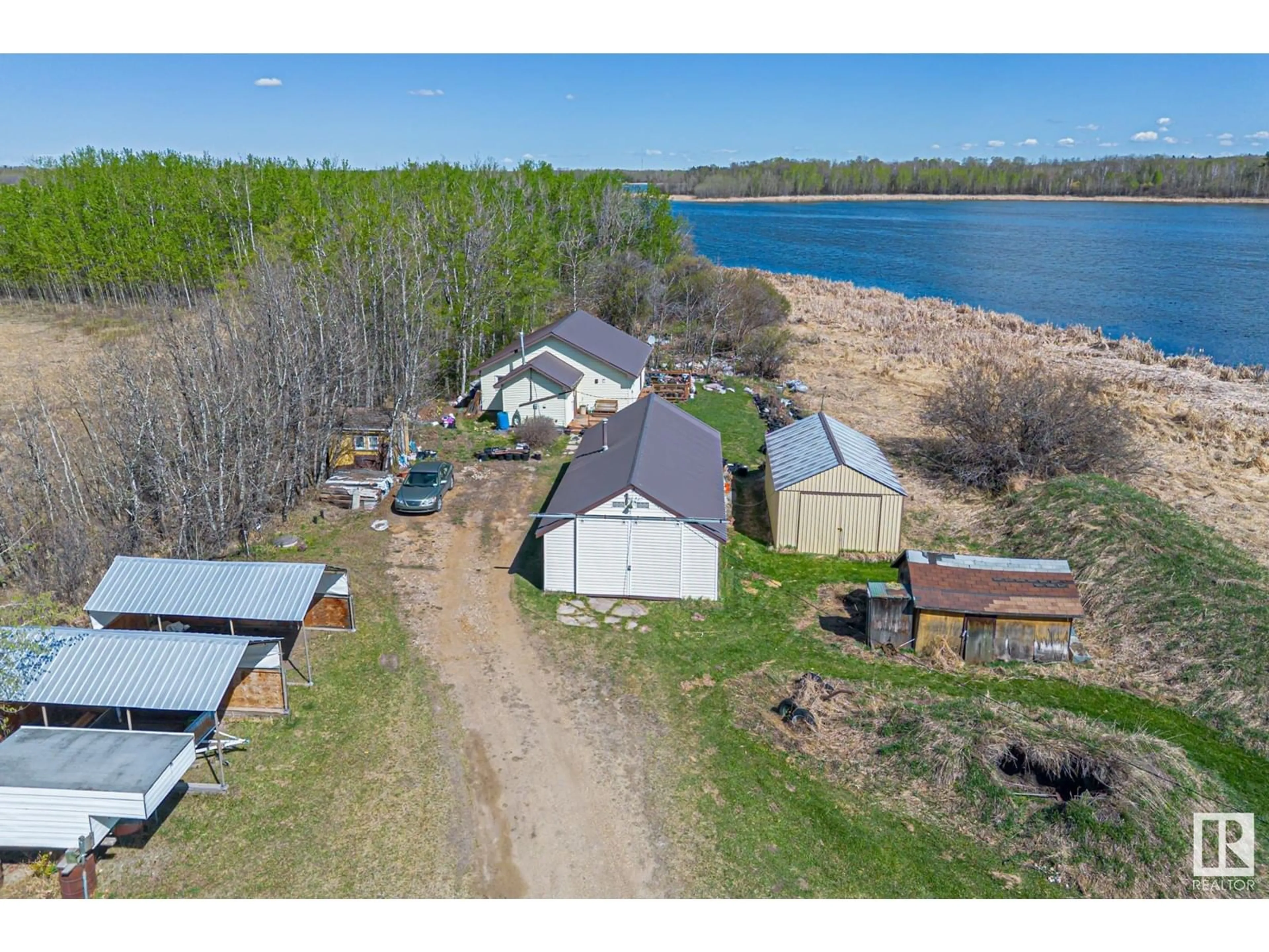 A pic from outside/outdoor area/front of a property/back of a property/a pic from drone, water/lake/river/ocean view for 52175 RGE ROAD 224, Rural Strathcona County Alberta T8C1B7