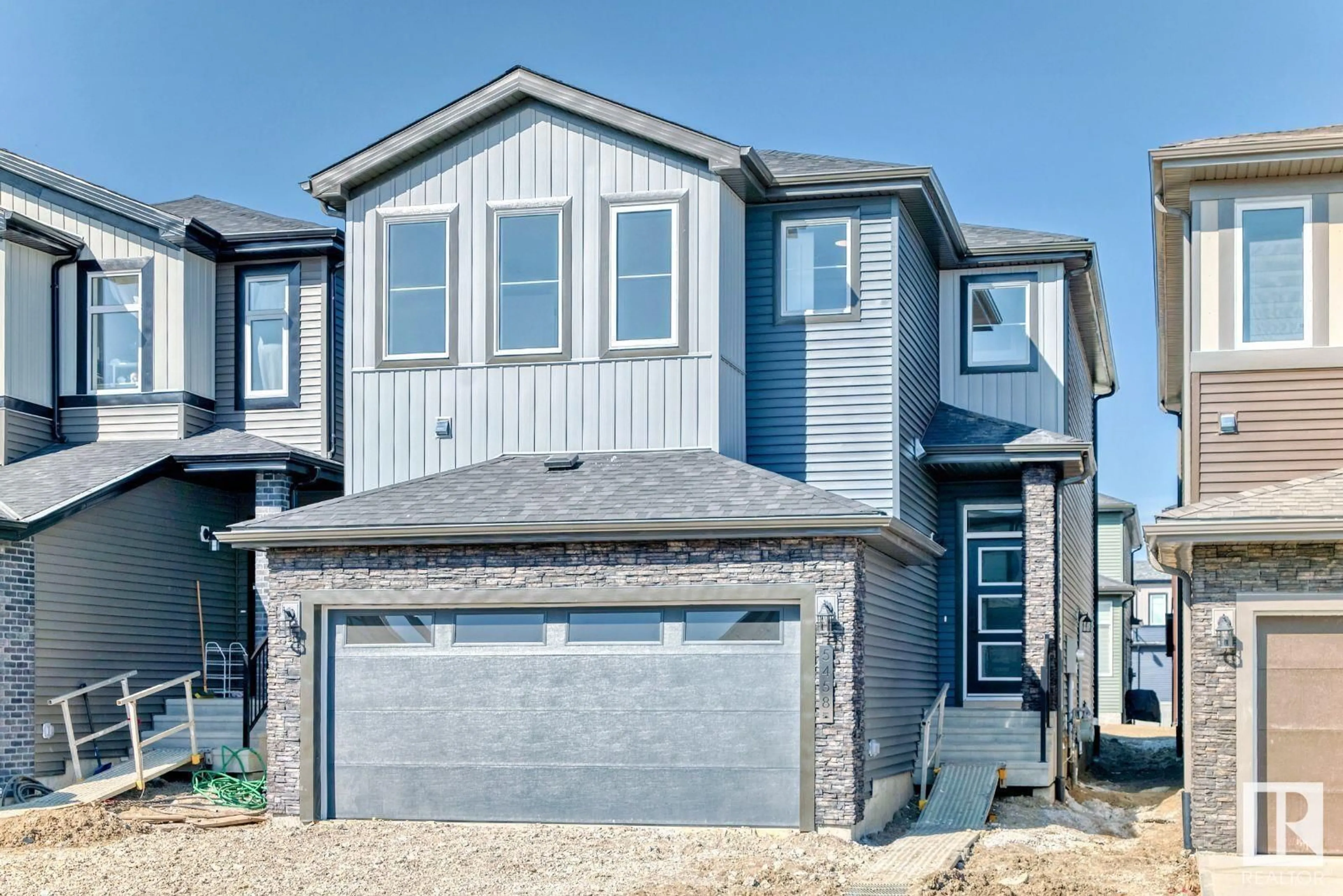 Home with vinyl exterior material, street for 5458 KOOTOOK RD, Edmonton Alberta T6W2Z5