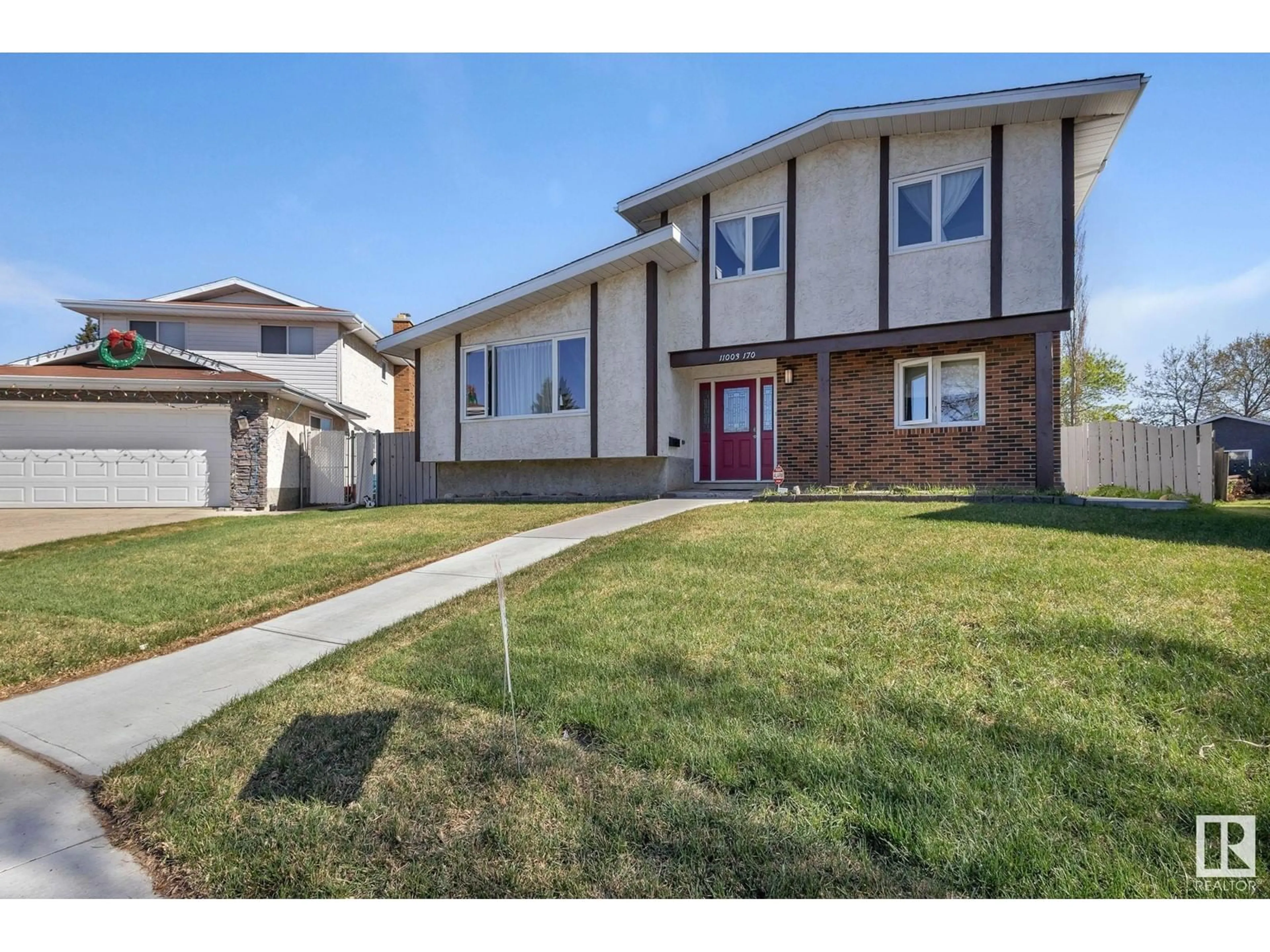 Home with vinyl exterior material, street for 11003 170 AV, Edmonton Alberta T5X3L1