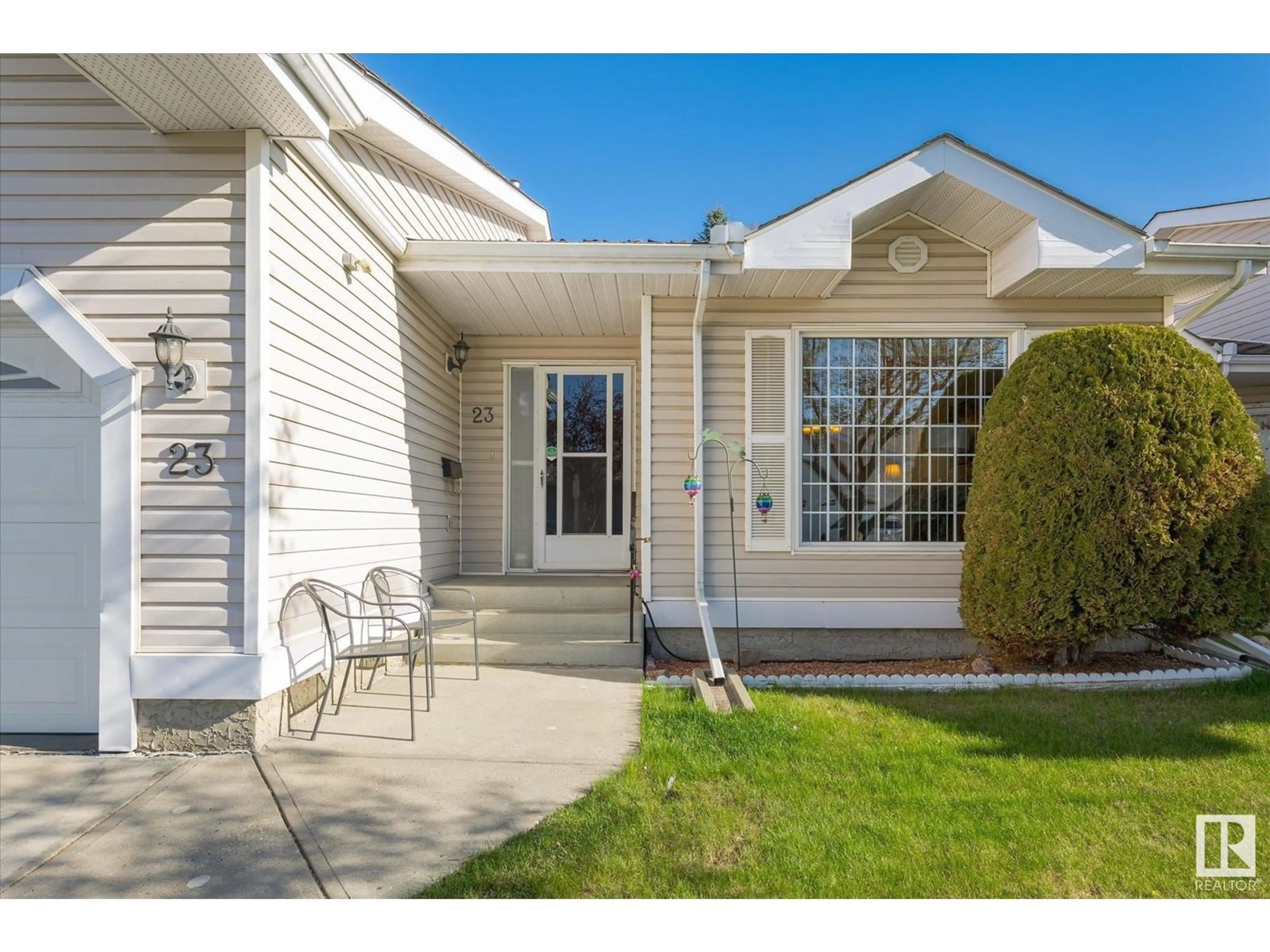 Home with vinyl exterior material, street for #23 - 9704 165 ST NW, Edmonton Alberta T5P4W4