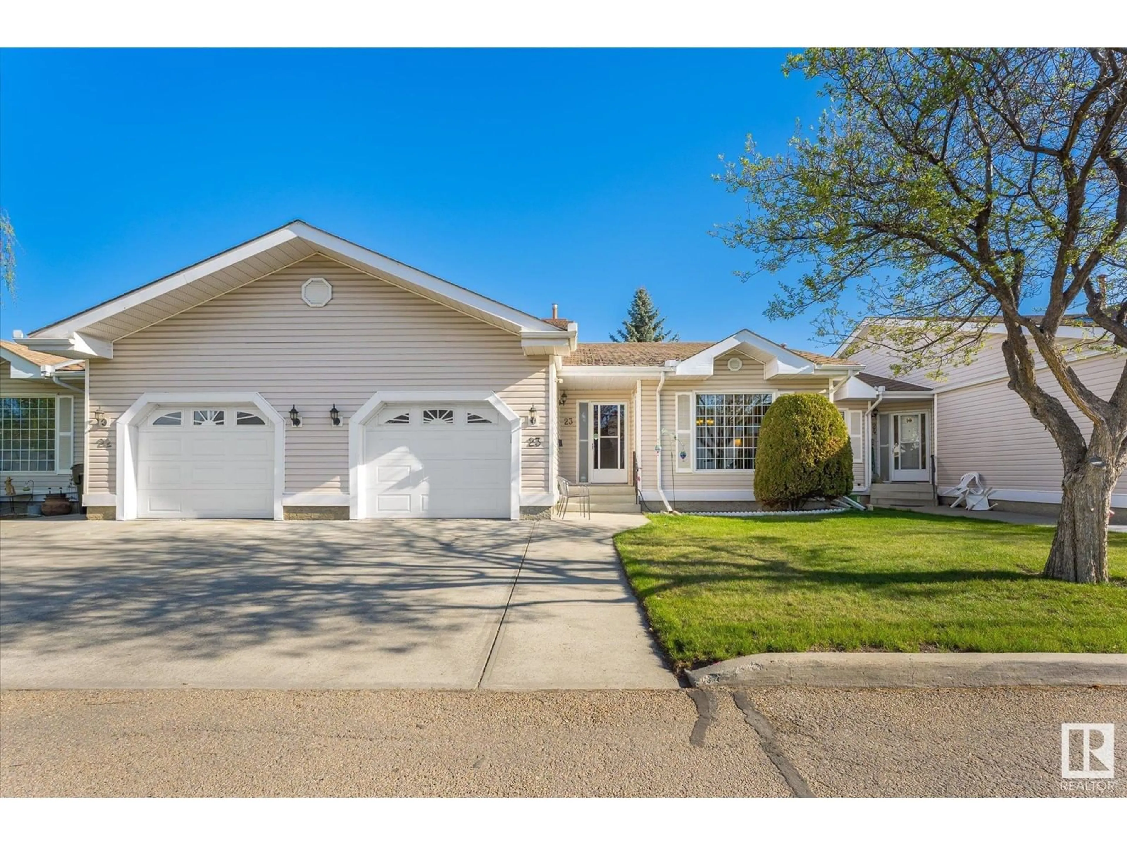 Home with vinyl exterior material, street for #23 - 9704 165 ST NW, Edmonton Alberta T5P4W4