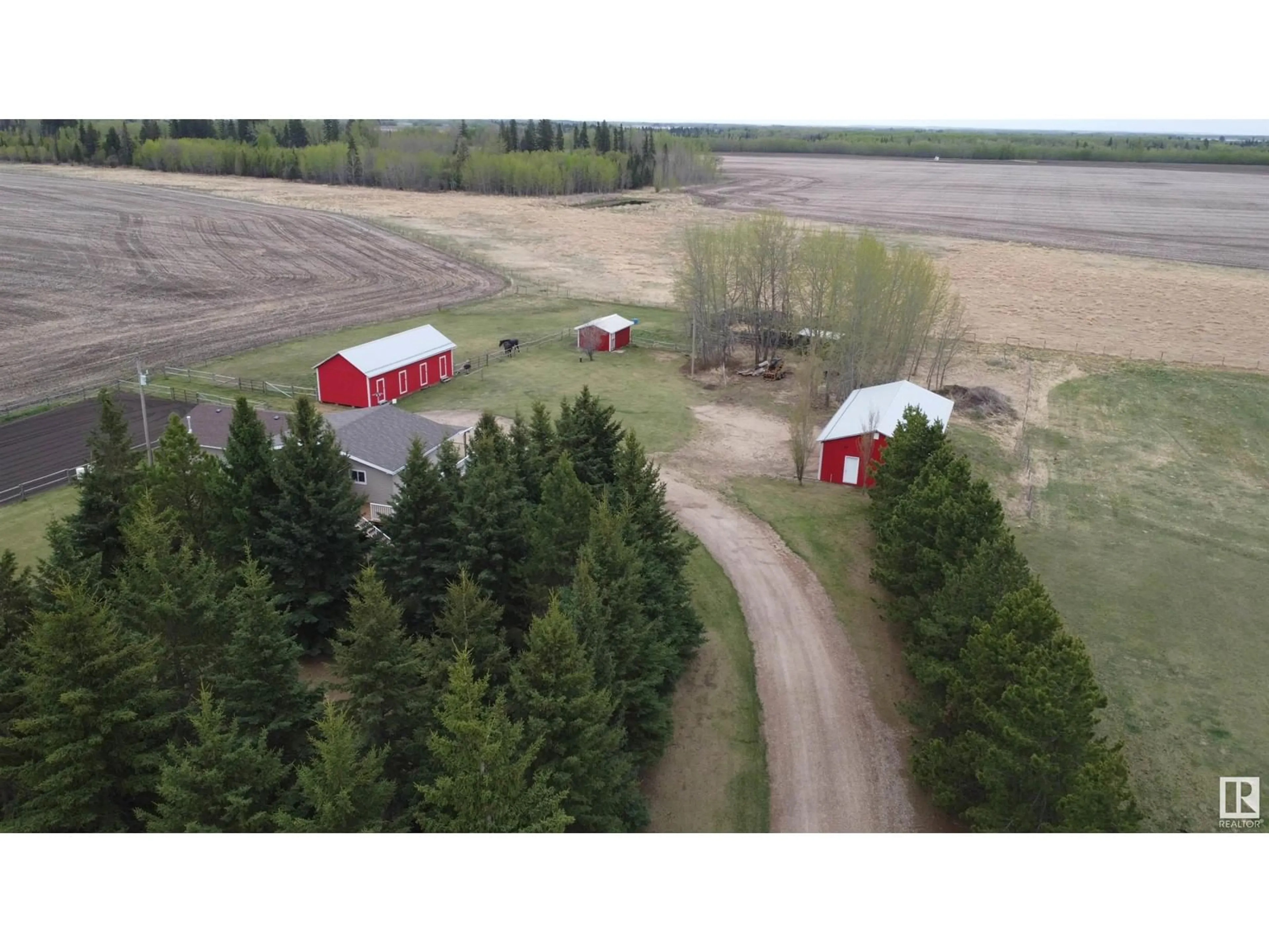 A pic from outside/outdoor area/front of a property/back of a property/a pic from drone, unknown for 28171 TWP ROAD 502, Rural Leduc County Alberta T0C2P0