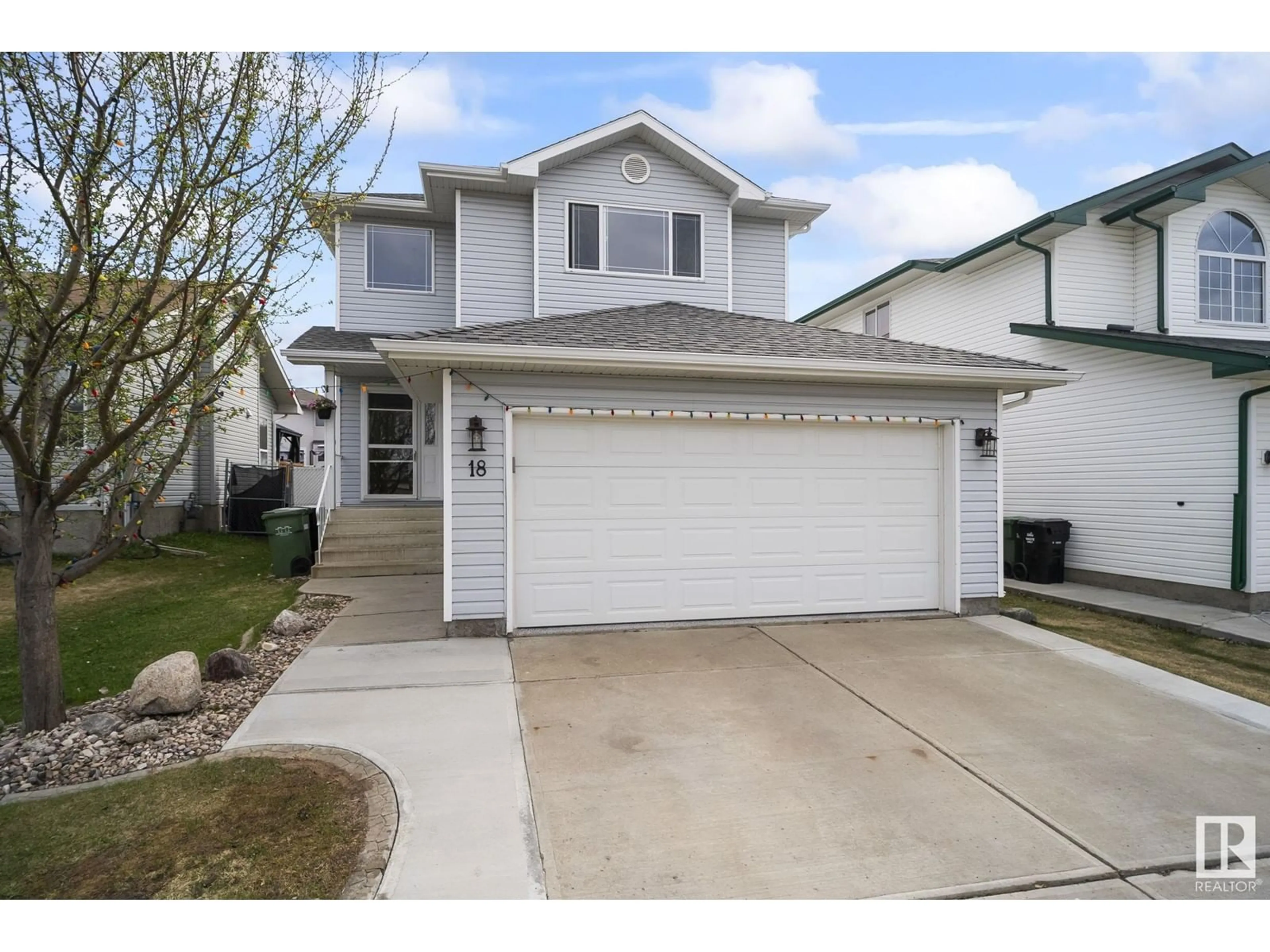 Home with vinyl exterior material, street for 18 BRIDGEPORT BLVD, Leduc Alberta T9E8G8