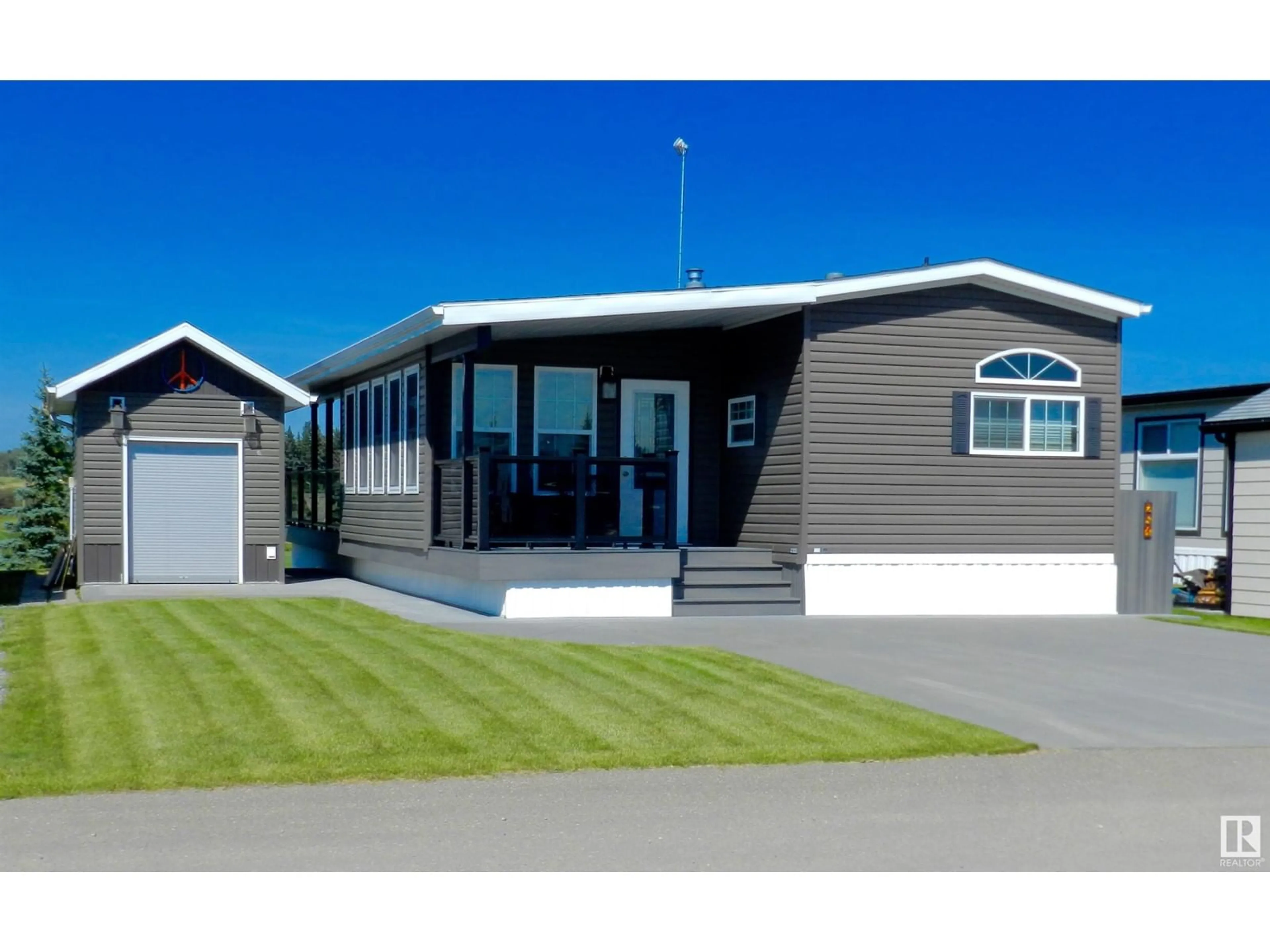 Home with vinyl exterior material, street for 53126 - 251 RGE ROAD 70, Rural Parkland County Alberta T0E0S0