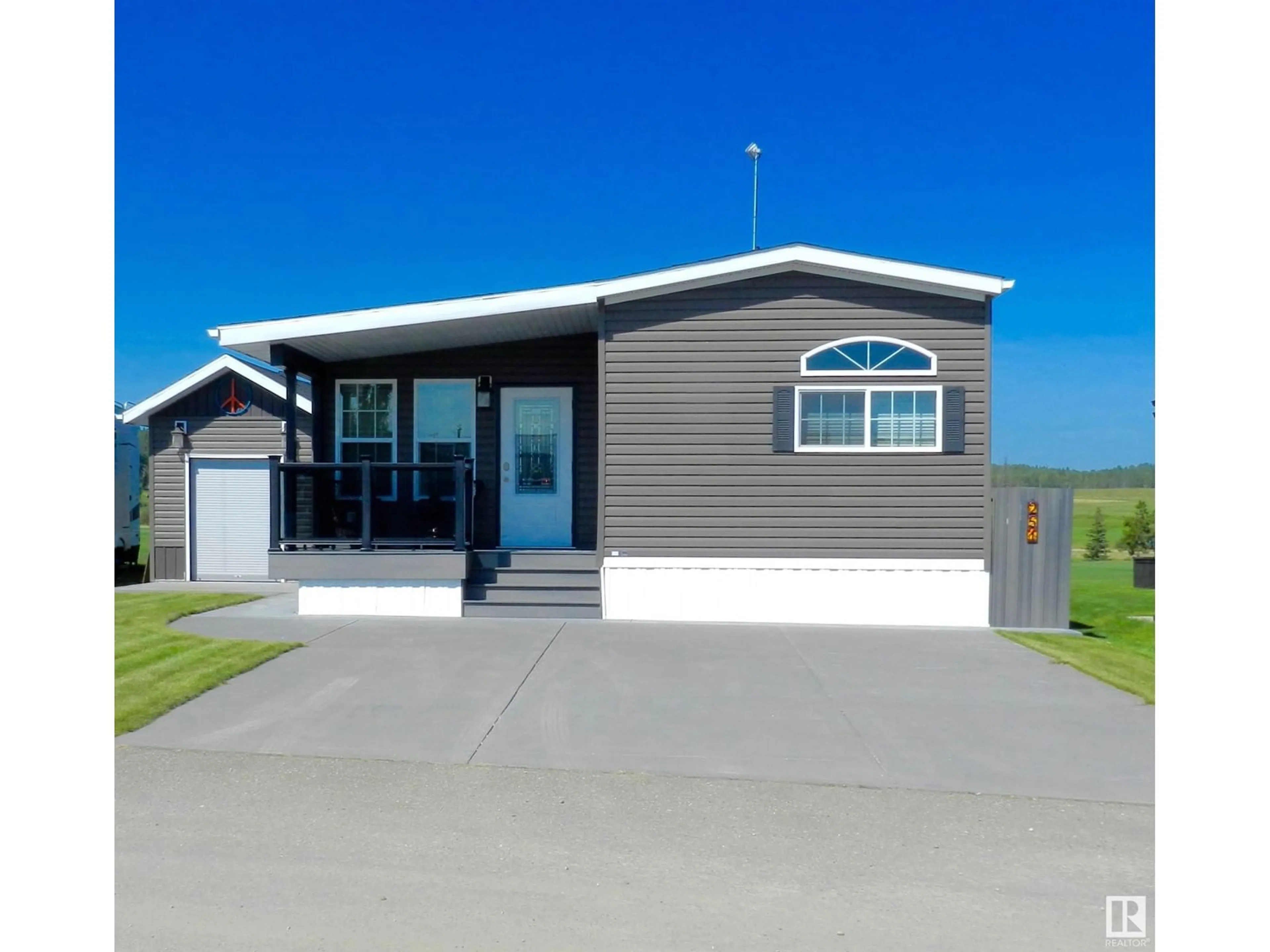 Home with vinyl exterior material, street for 53126 - 251 RGE ROAD 70, Rural Parkland County Alberta T0E0S0