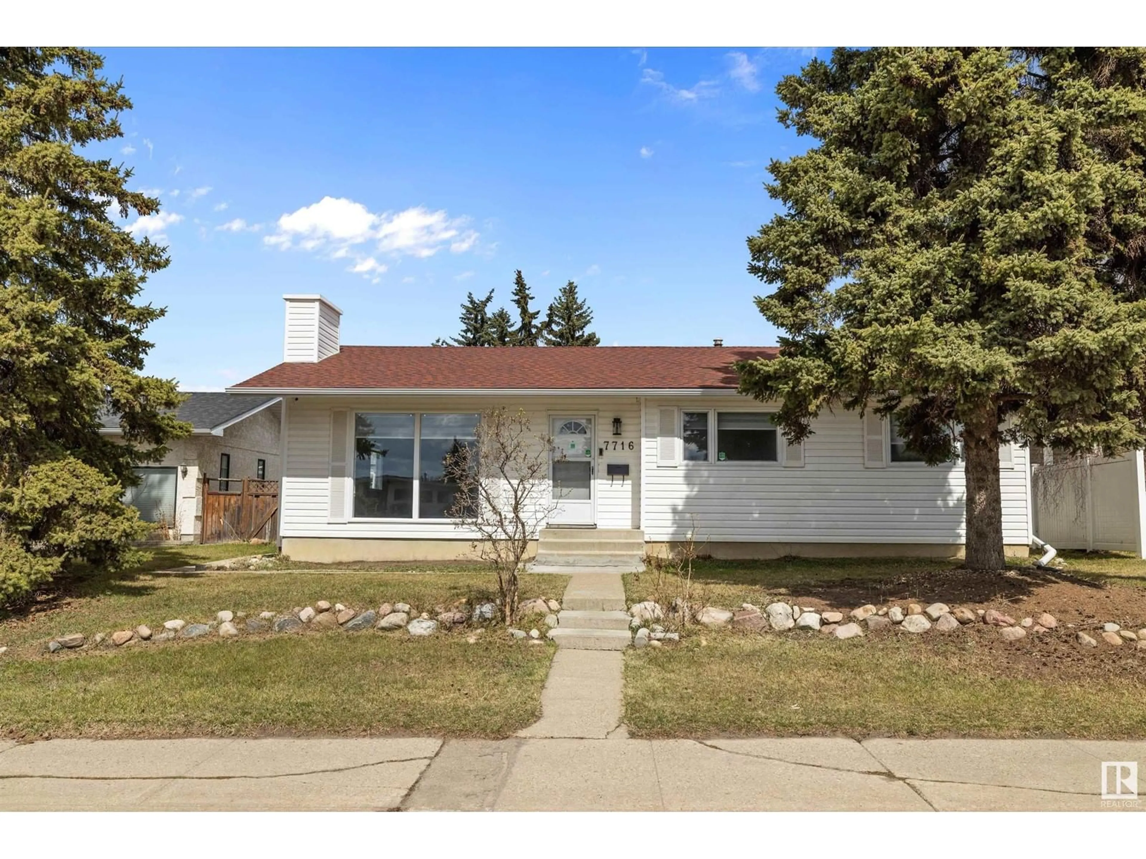 Home with vinyl exterior material, street for 7716 144 AV, Edmonton Alberta T5C2S1