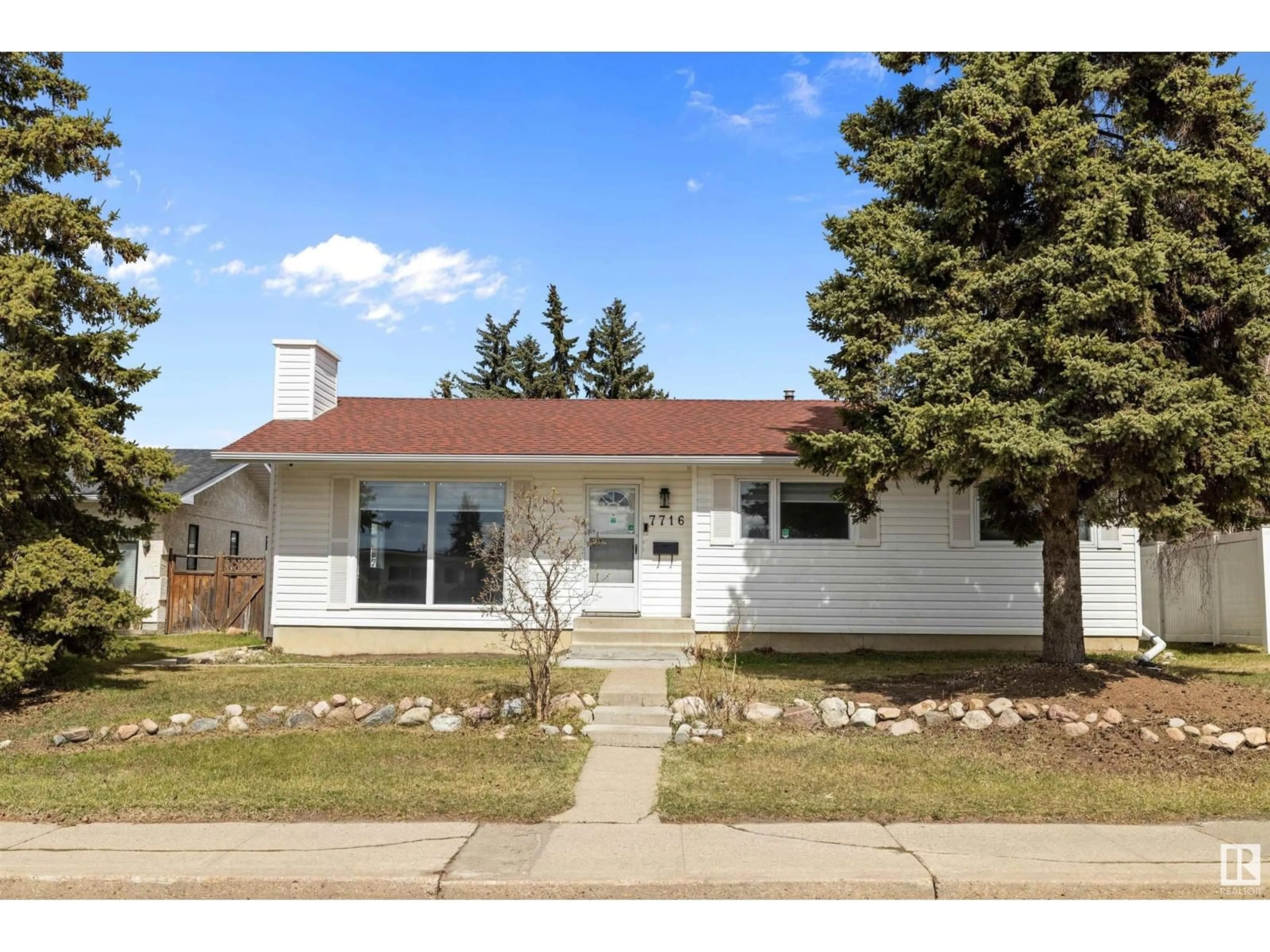 Home with vinyl exterior material, street for 7716 144 AV, Edmonton Alberta T5C2S1