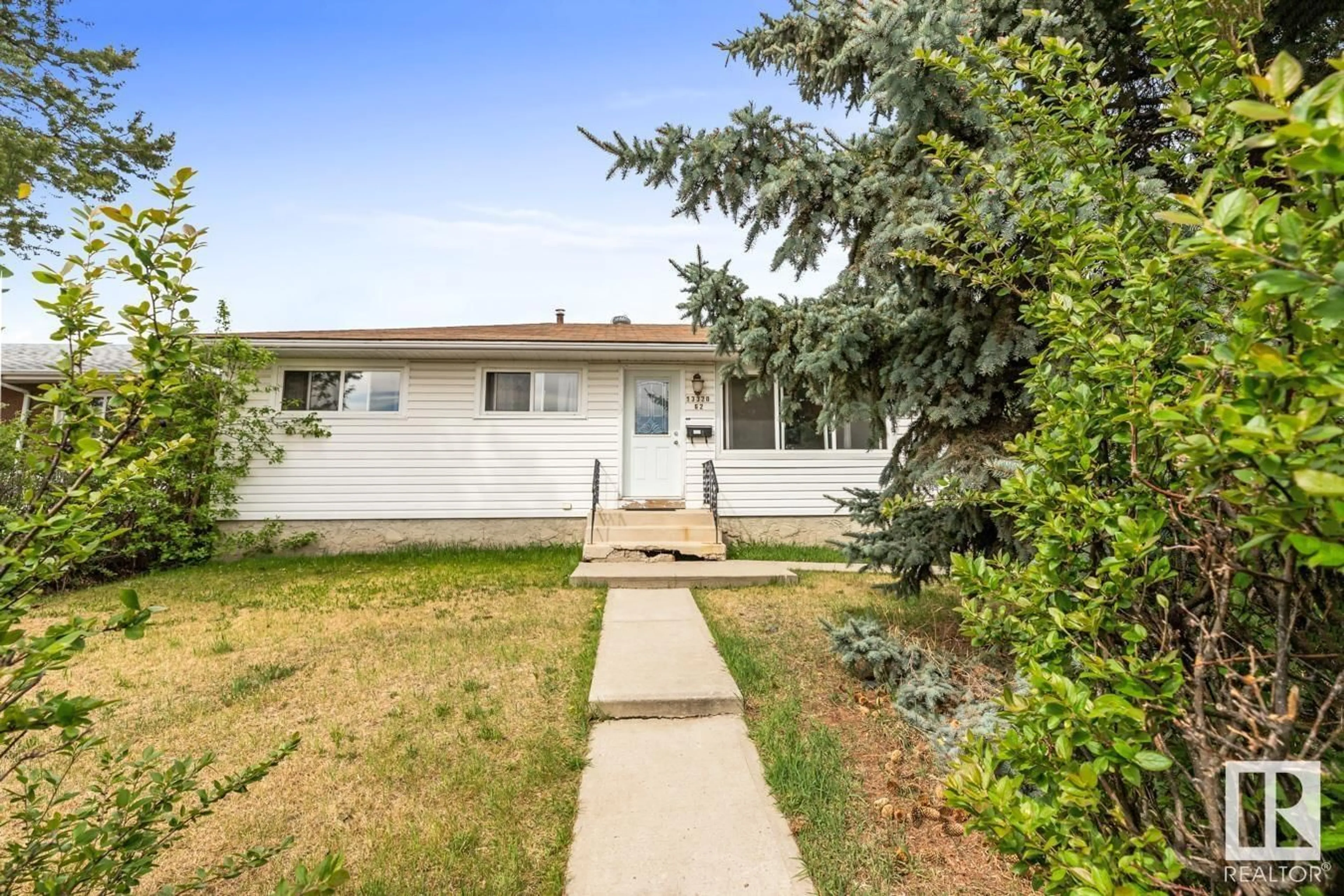 Home with vinyl exterior material, street for NW - 13320 62 ST, Edmonton Alberta T5A0V6