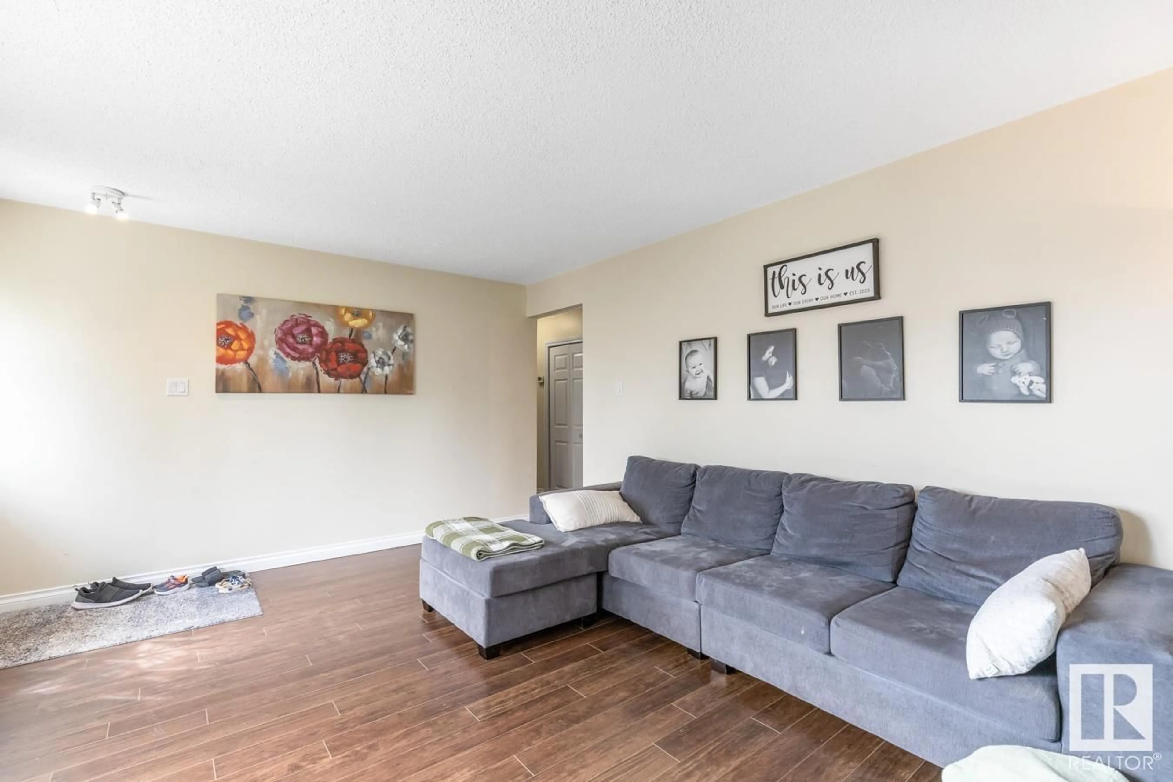 Living room with furniture, wood/laminate floor for NW - 13320 62 ST, Edmonton Alberta T5A0V6