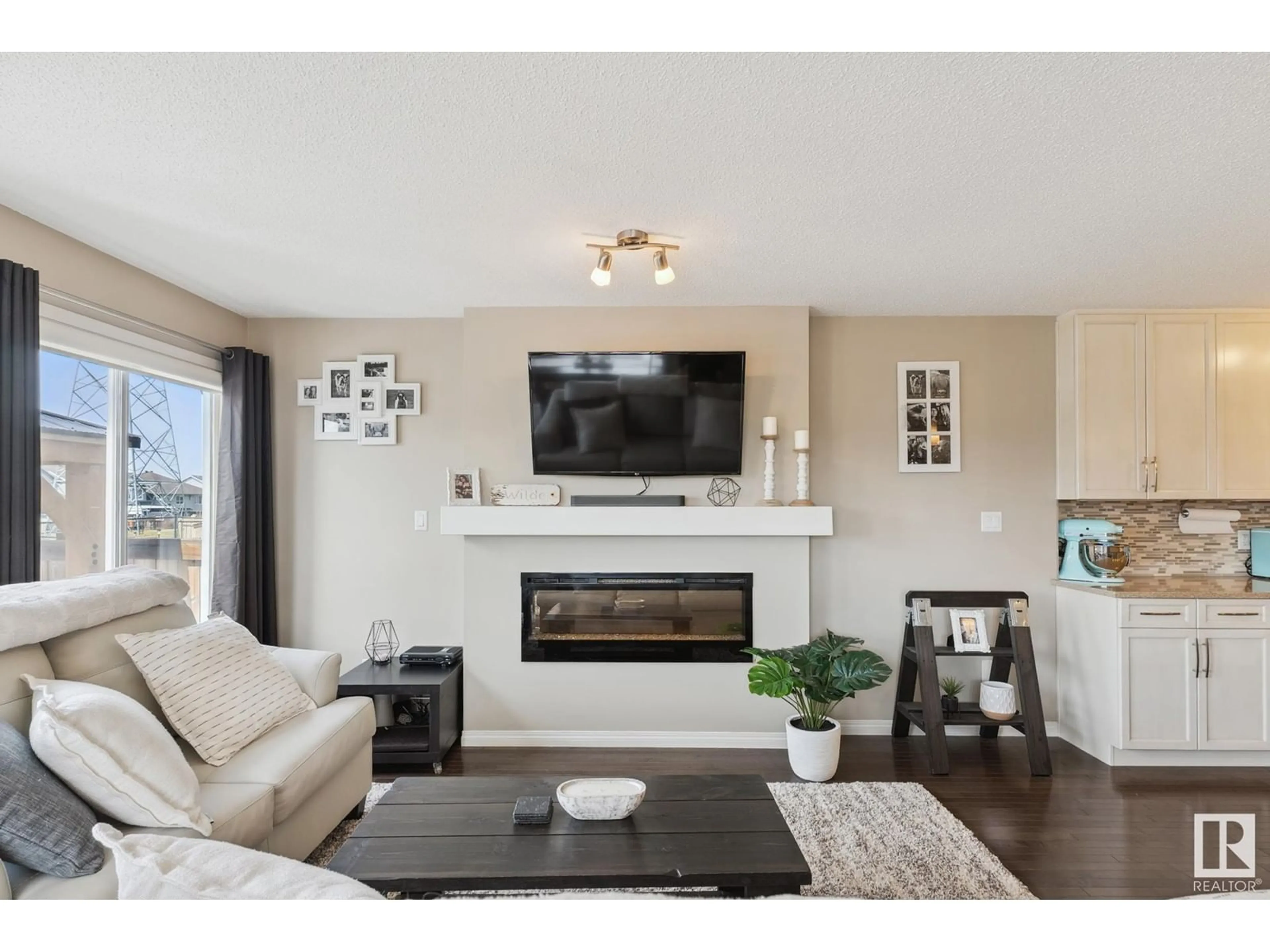 Living room with furniture, wood/laminate floor for 1750 CHAPMAN WY, Edmonton Alberta T6W2E8