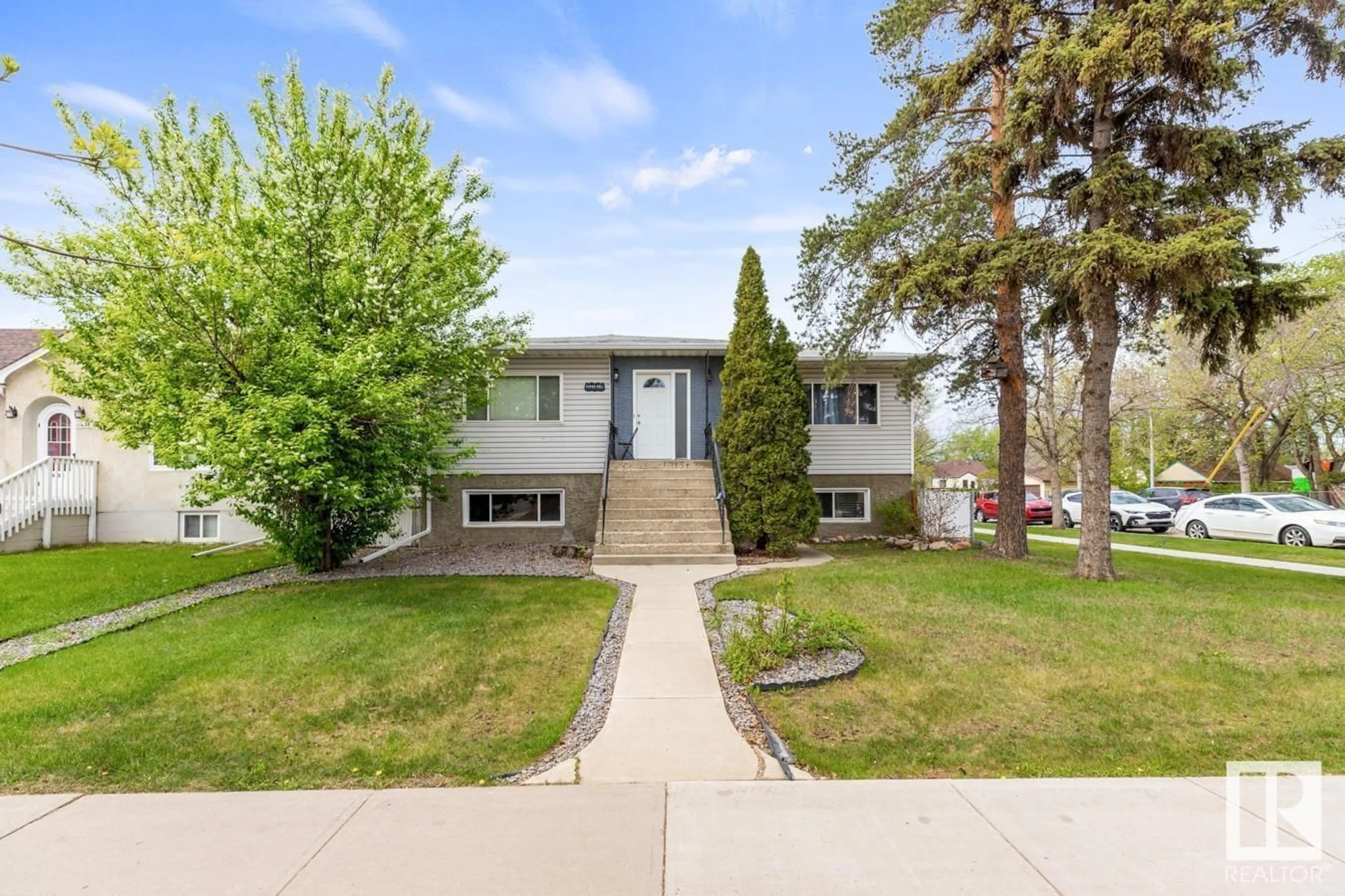 Home with vinyl exterior material, street for NW - 11442 101 ST, Edmonton Alberta T5G2A8