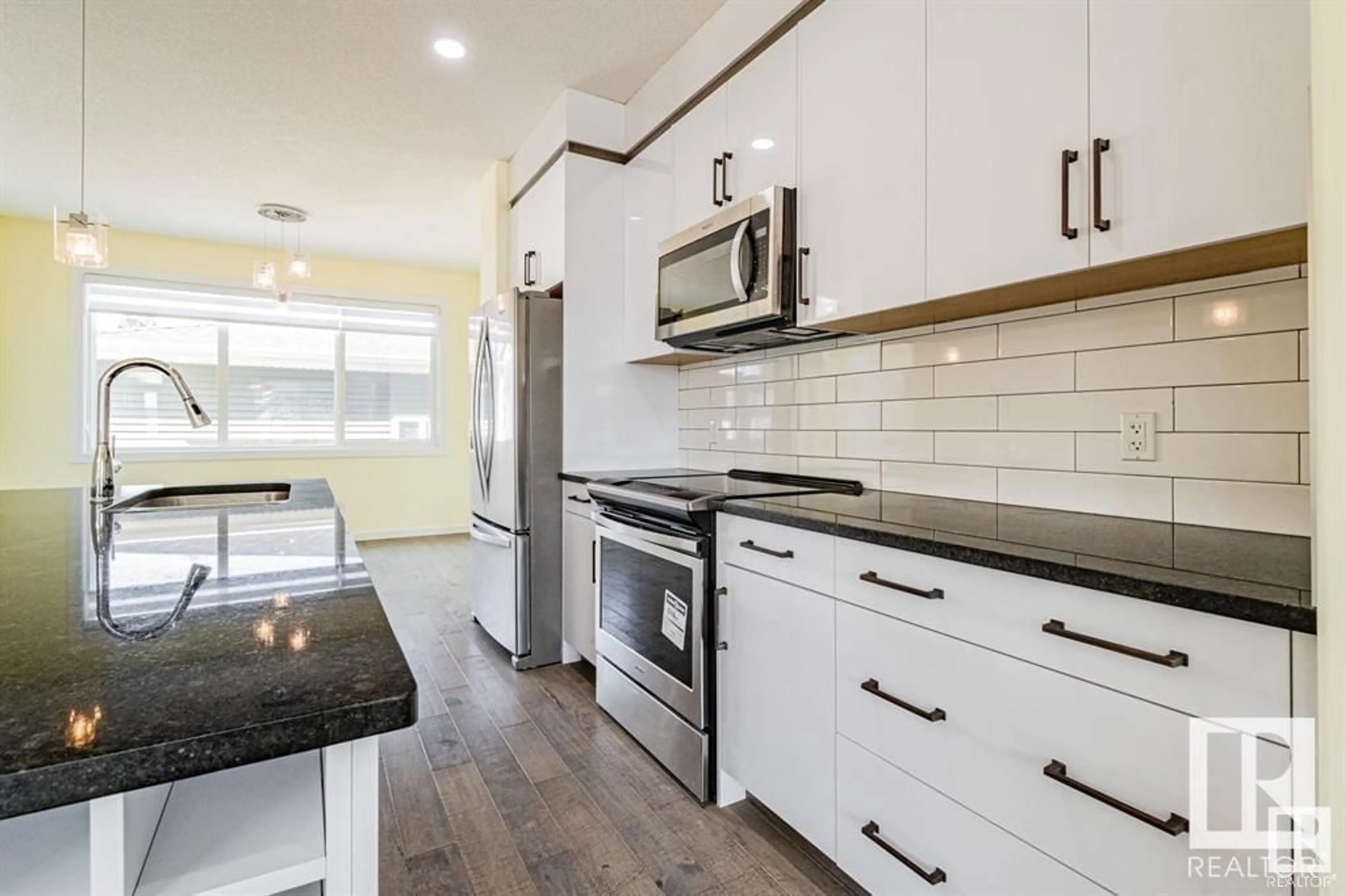 Open concept kitchen, ceramic/tile floor for 10576 62 AV, Edmonton Alberta T6H1M4