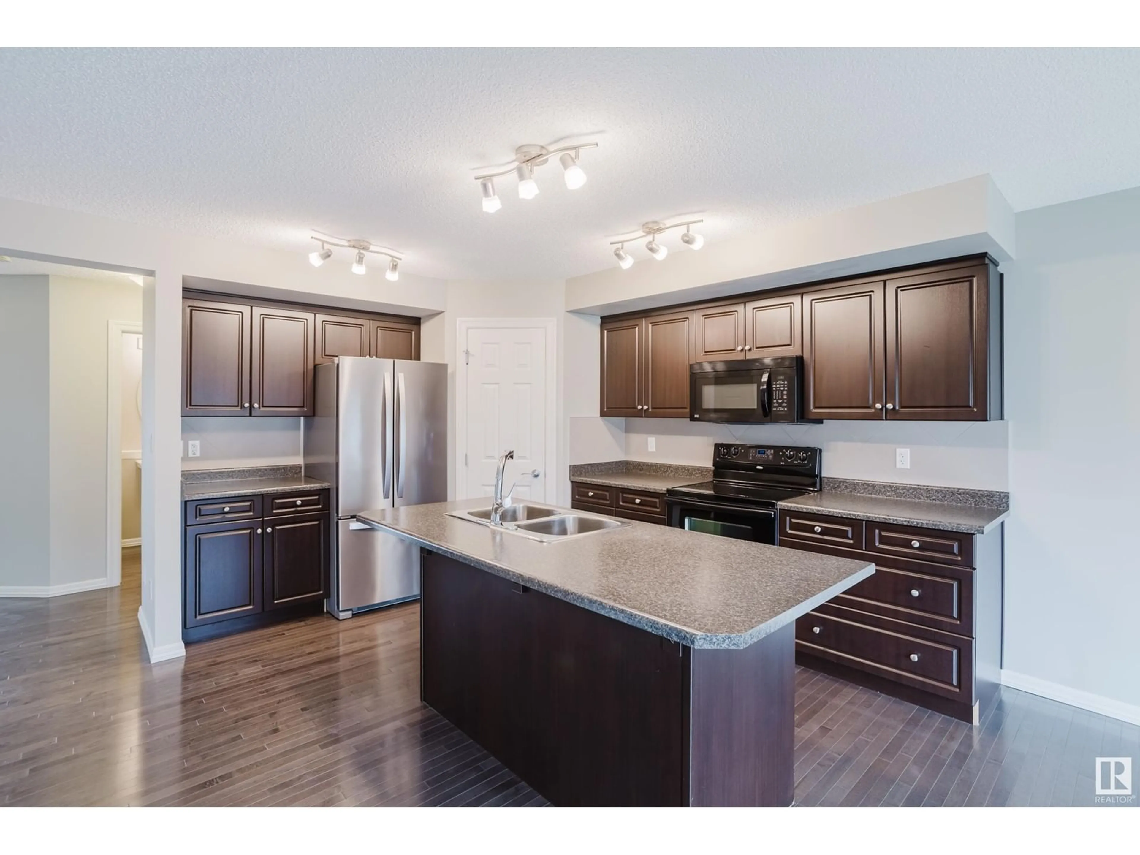 Open concept kitchen, wood/laminate floor for 6213 60 ST, Beaumont Alberta T4X0J3