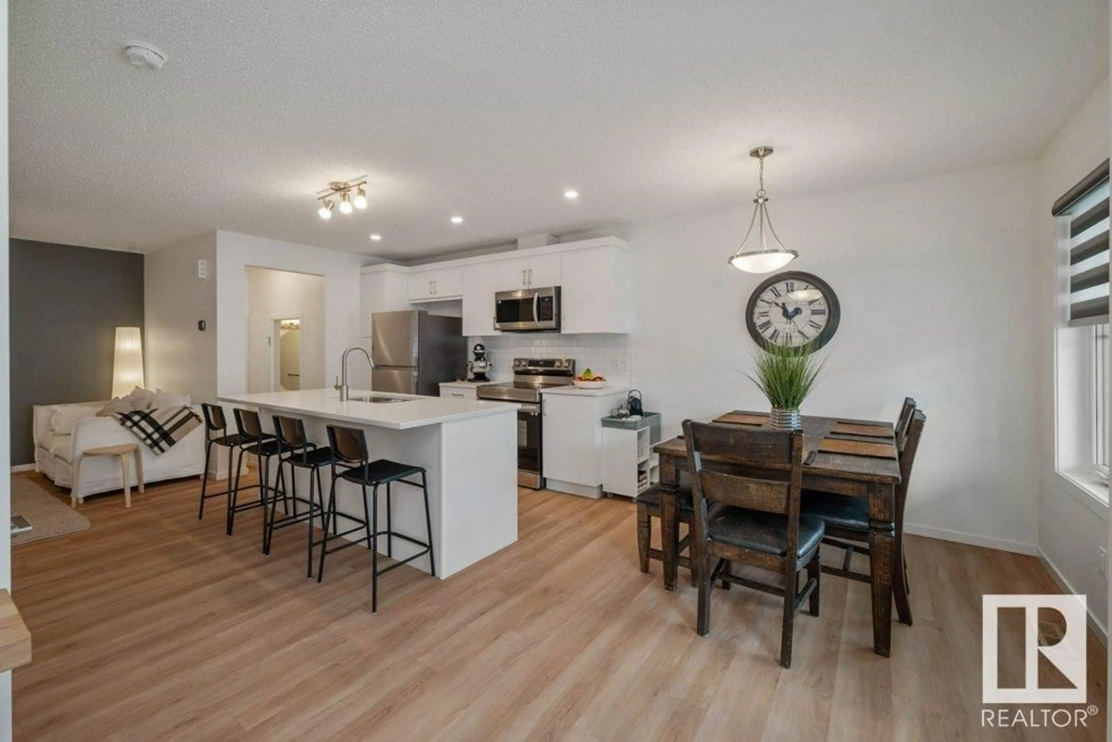 Open concept kitchen, wood/laminate floor for 20615 21 AVE NW, Edmonton Alberta T6M1N2