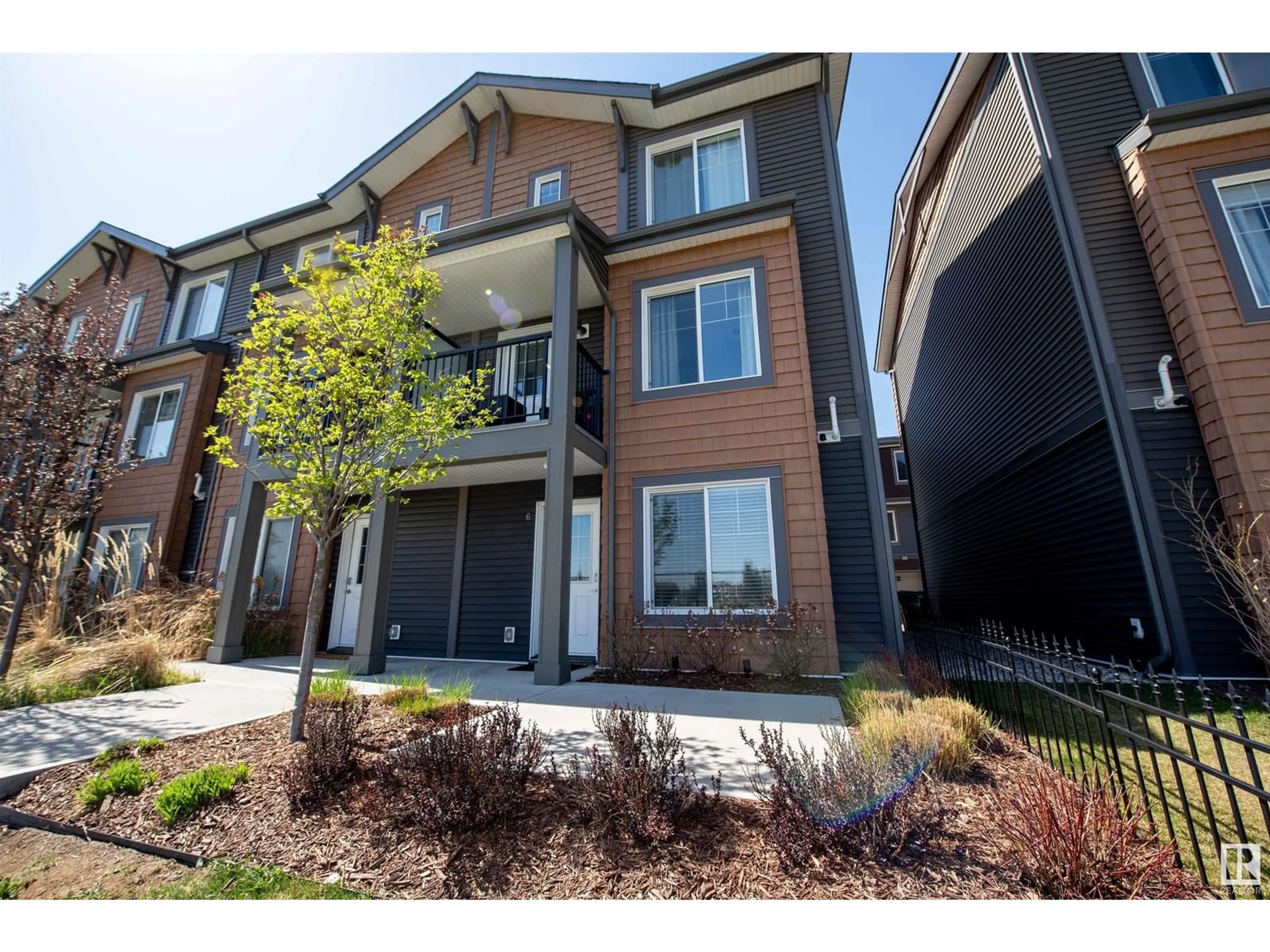 Home with brick exterior material, street for #6 - 3025 151 AV, Edmonton Alberta T5Y3W4