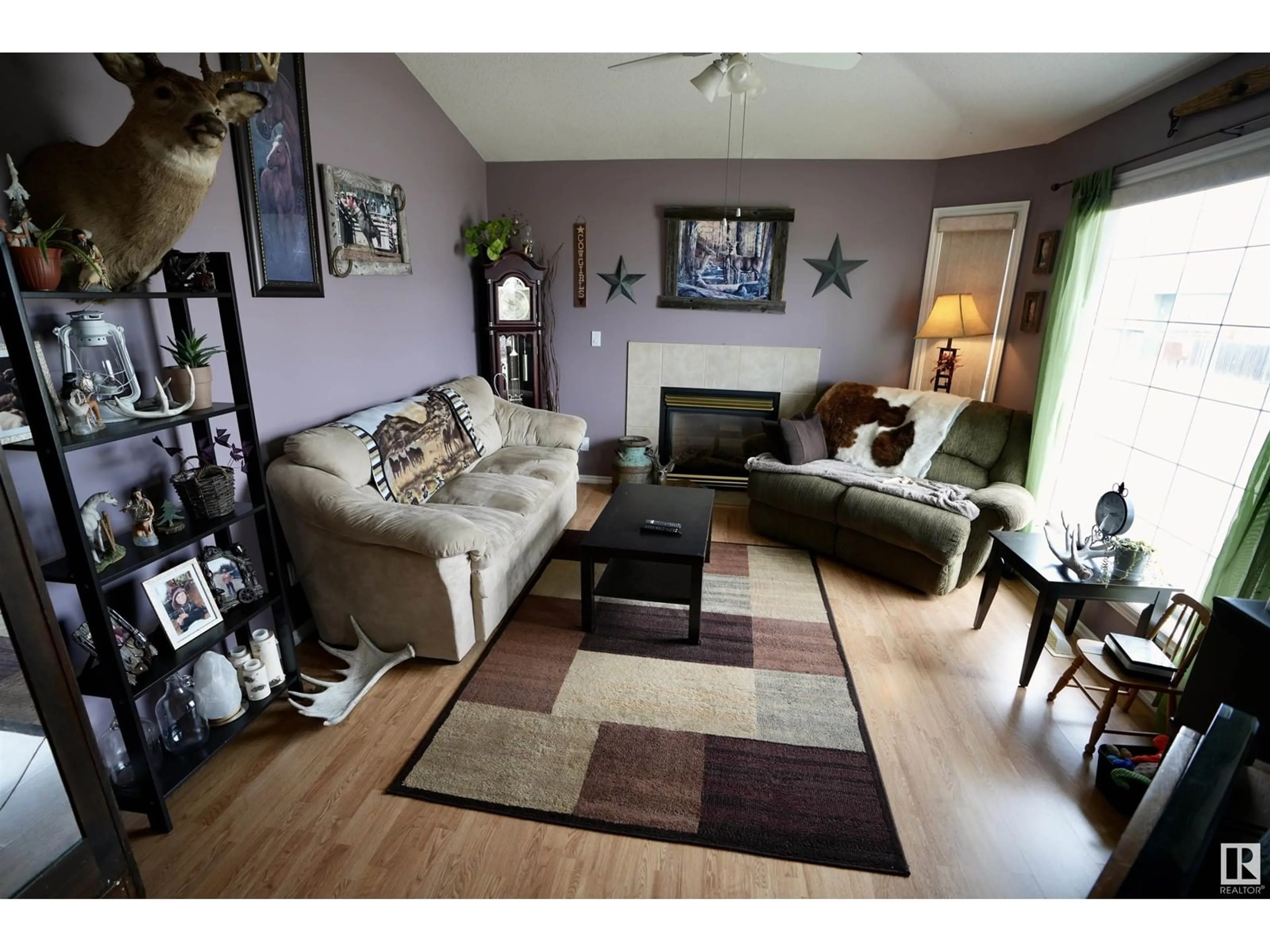 Living room with furniture, wood/laminate floor for 4506&4502 50 ST, St. Paul Town Alberta T0A3A4