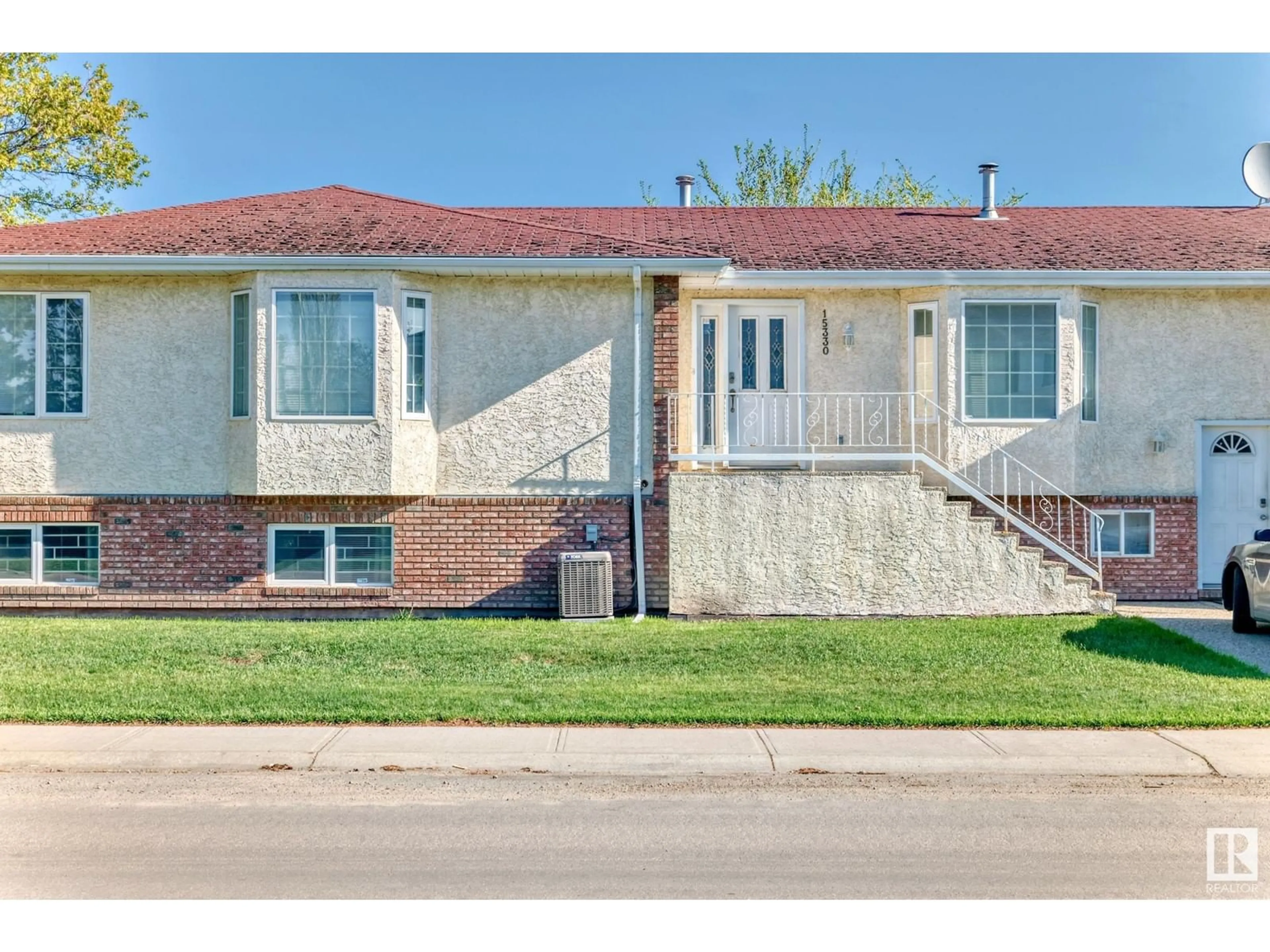 Home with brick exterior material, street for NW - 15330 99 AV, Edmonton Alberta T5P0H9