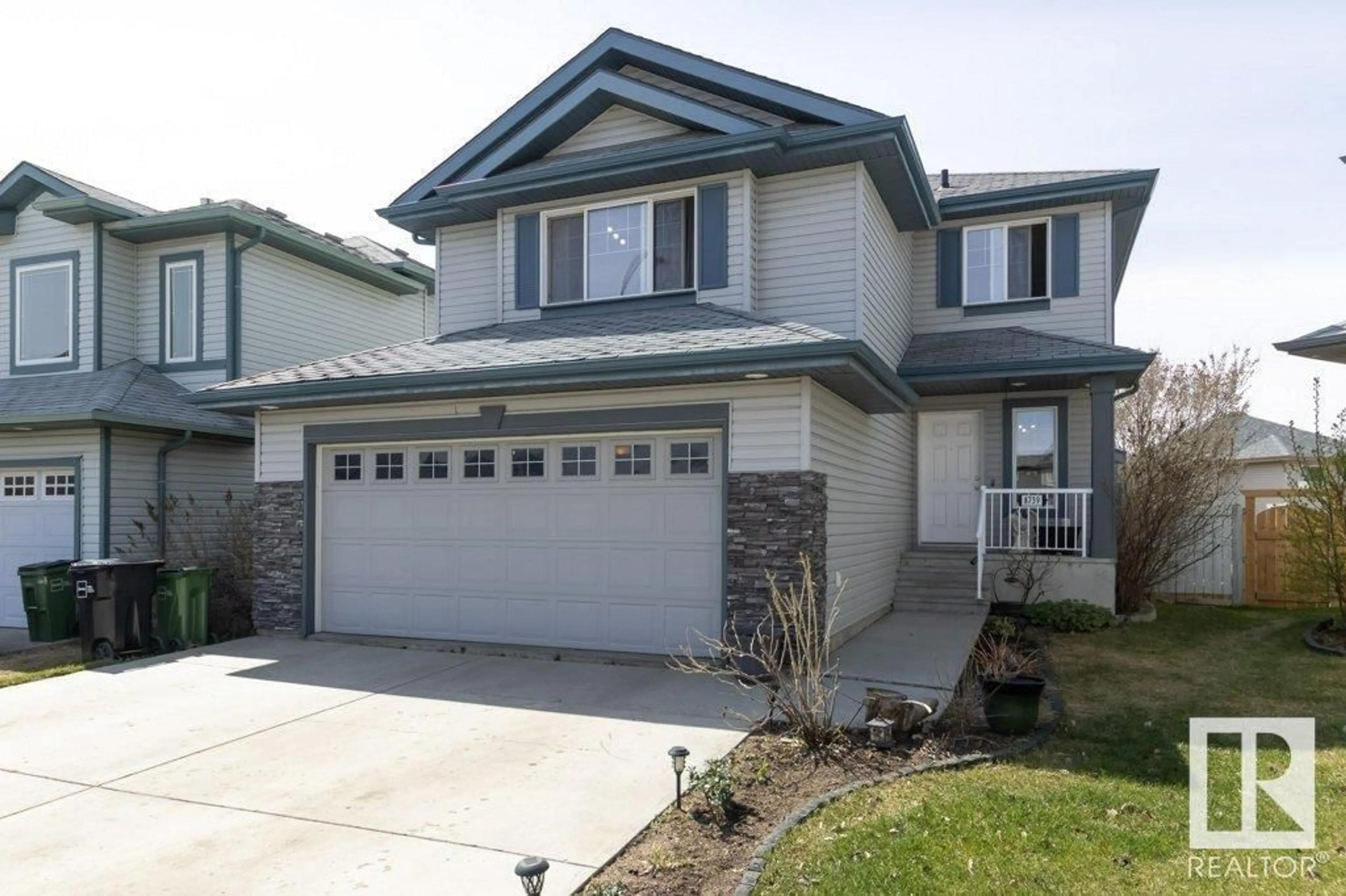 Home with vinyl exterior material, street for NW - 8739 178 AV, Edmonton Alberta T5Z0B8