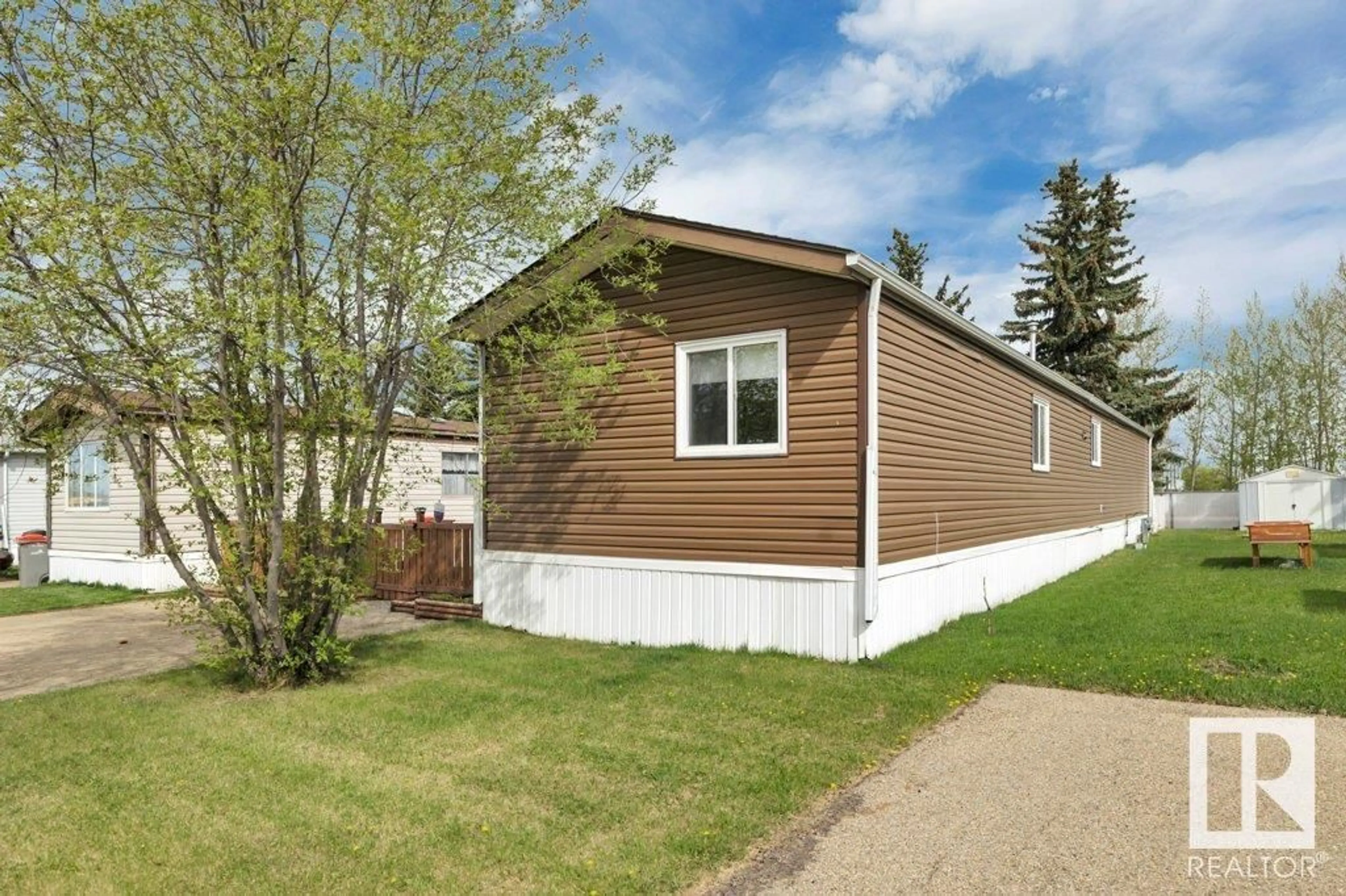 Home with vinyl exterior material, street for 4819 - 19 51 AV, Millet Alberta T0C1Z0