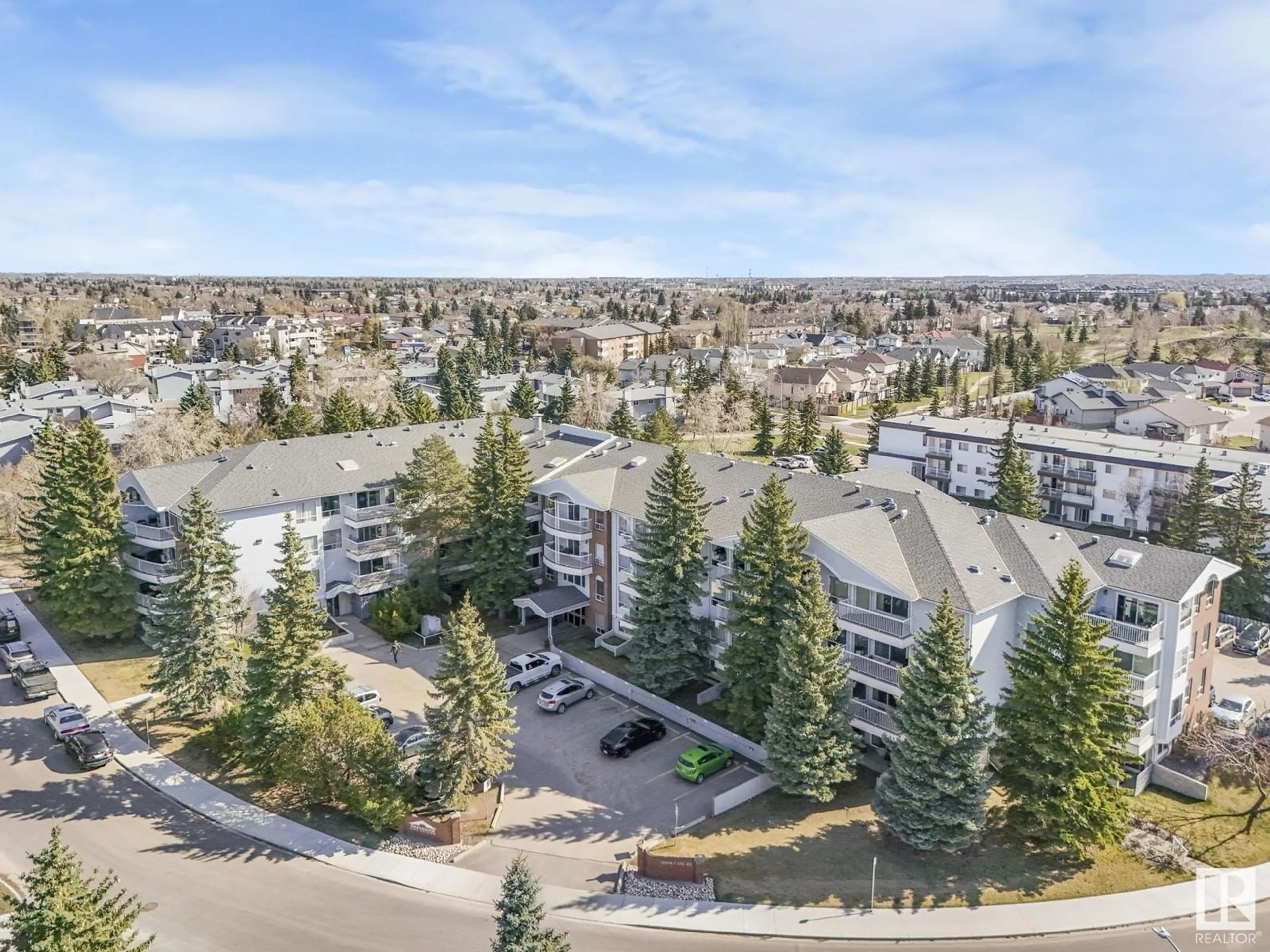 A pic from outside/outdoor area/front of a property/back of a property/a pic from drone, mountain view for #410 - 15503 106 ST, Edmonton Alberta T5X5W7
