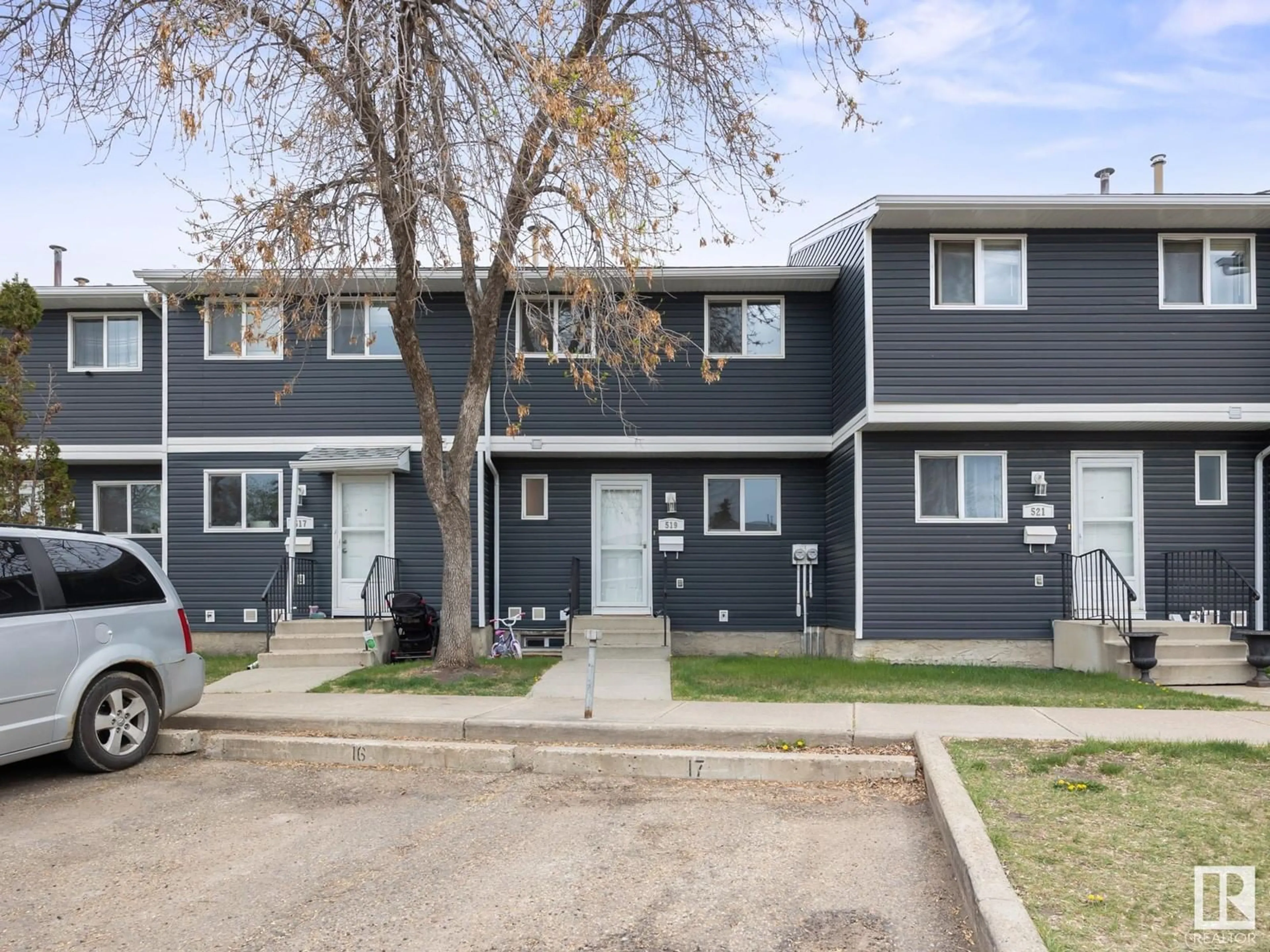Home with vinyl exterior material, street for 519 DUNLUCE RD, Edmonton Alberta T5X4P4